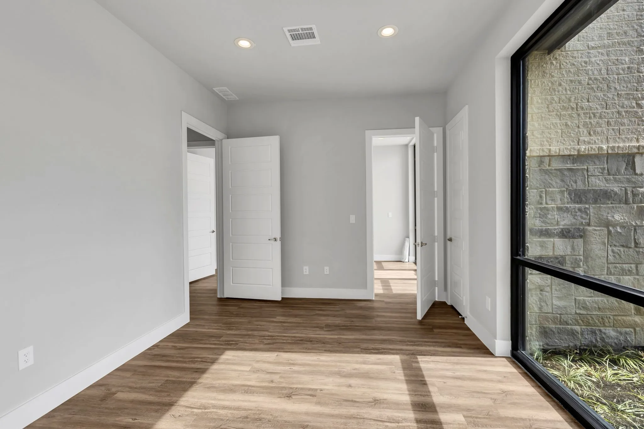 Unfurnished bedroom featuring light wood-type flooring and recessed lighting