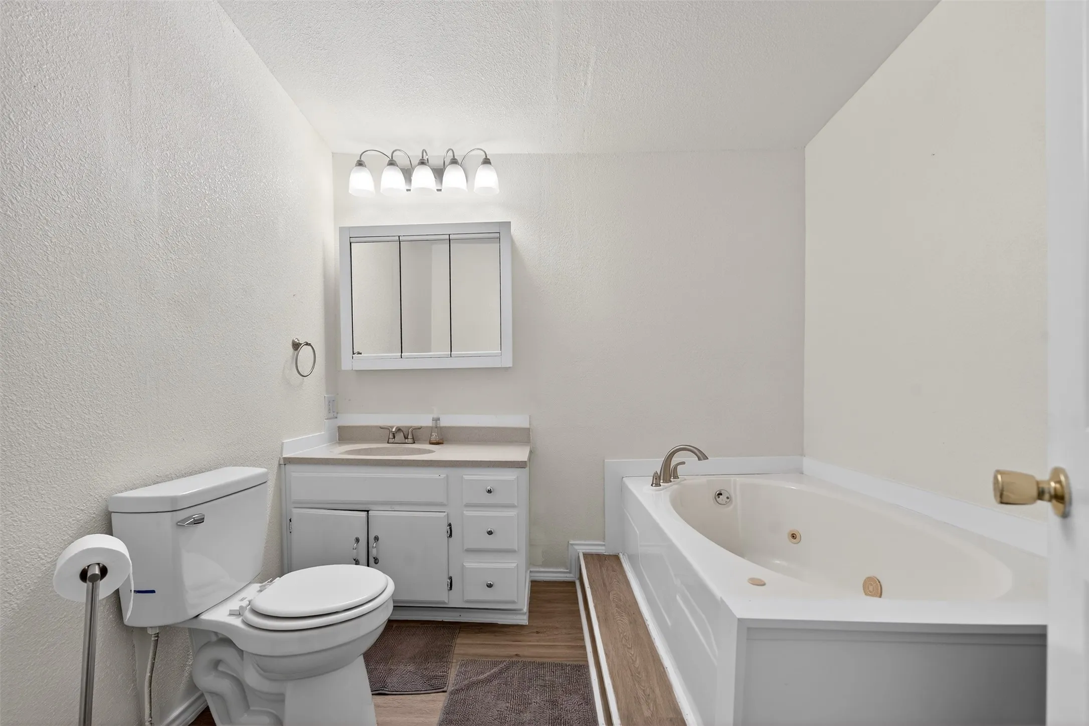 Plumbing is in the wall to add a standup shower behind the door