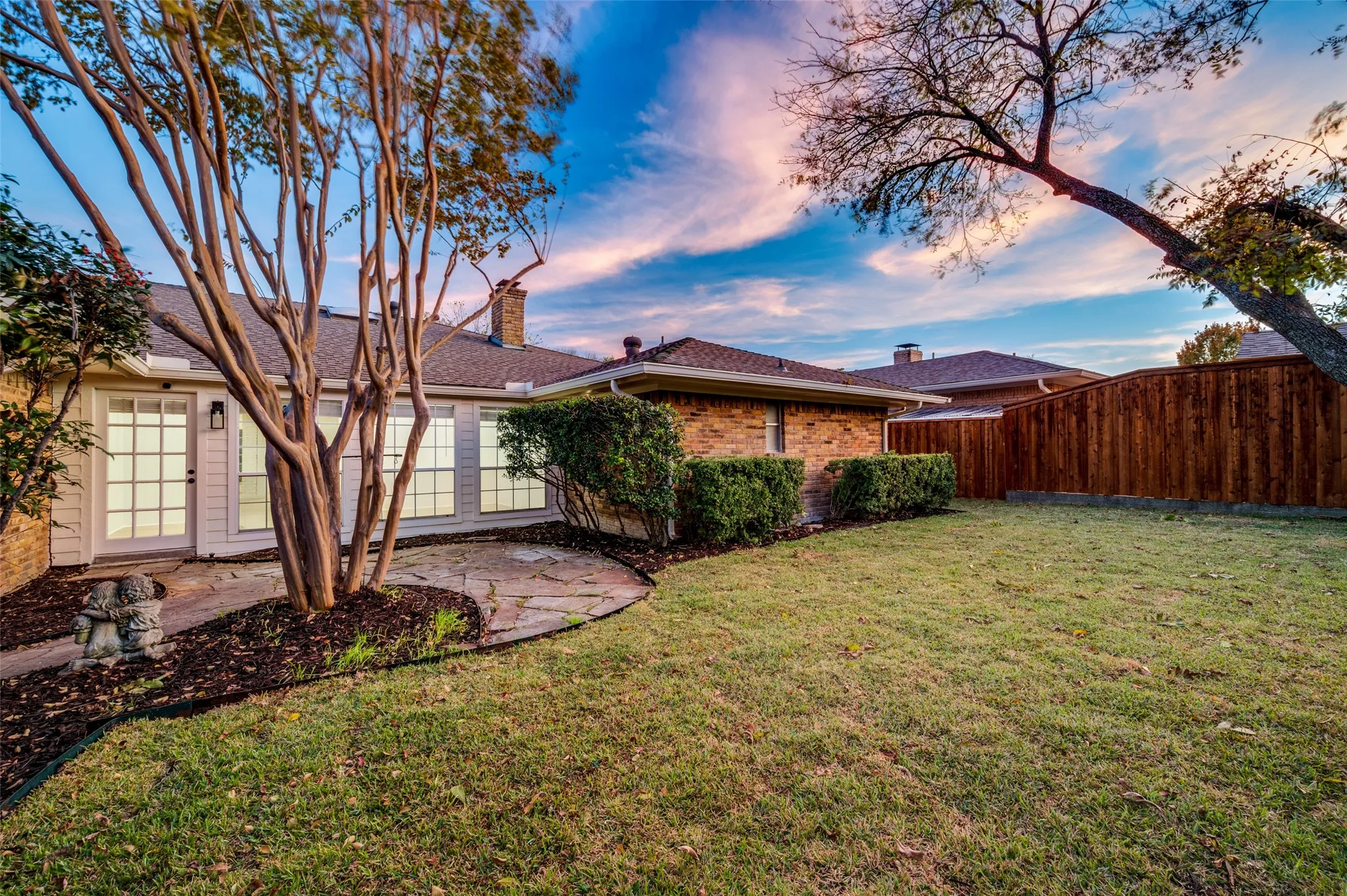 Private backyard retreat with fresh sod and manicured lawn—perfect for entertaining, pets, or relaxed evenings outdoors.