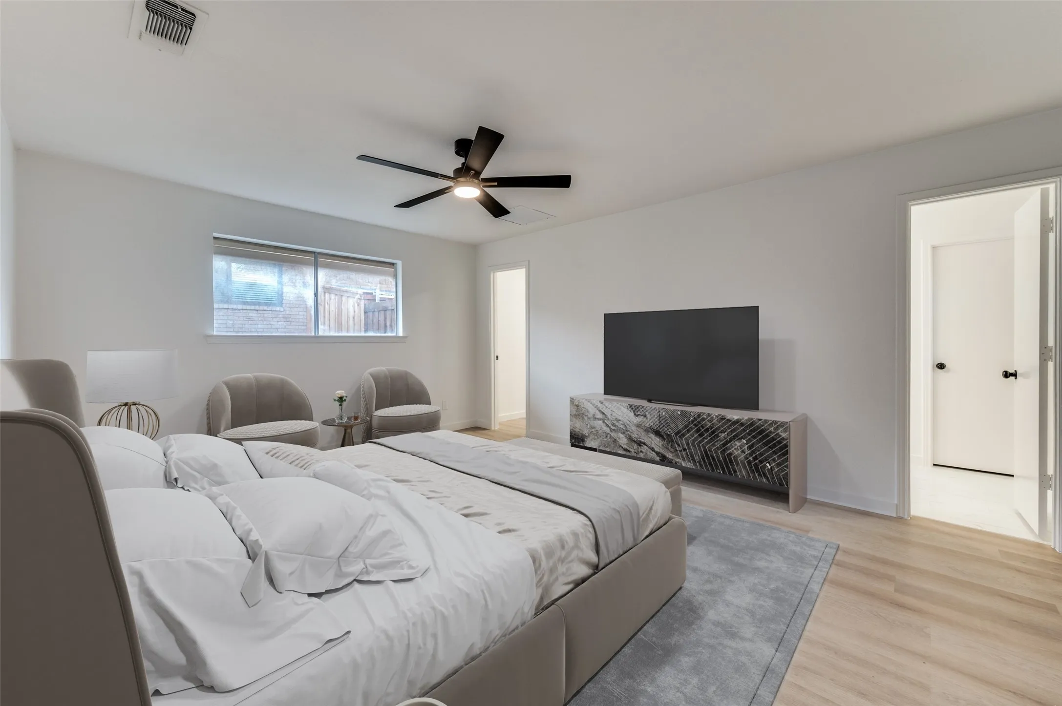 The spacious primary suite offers a tranquil retreat with access to a large walk-in closet and glamorous ensuite bathroom.