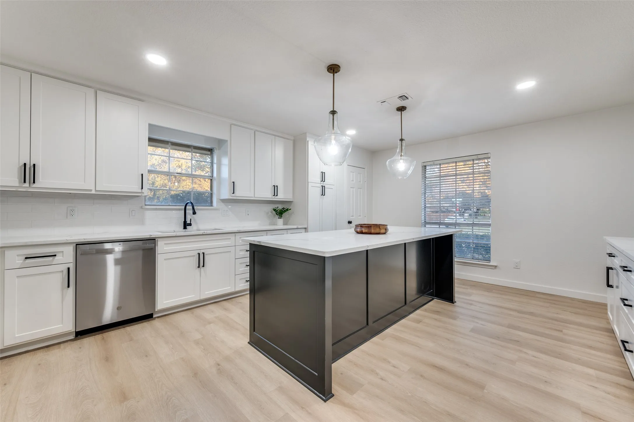 Stunning kitchen with designer pendant lighting.