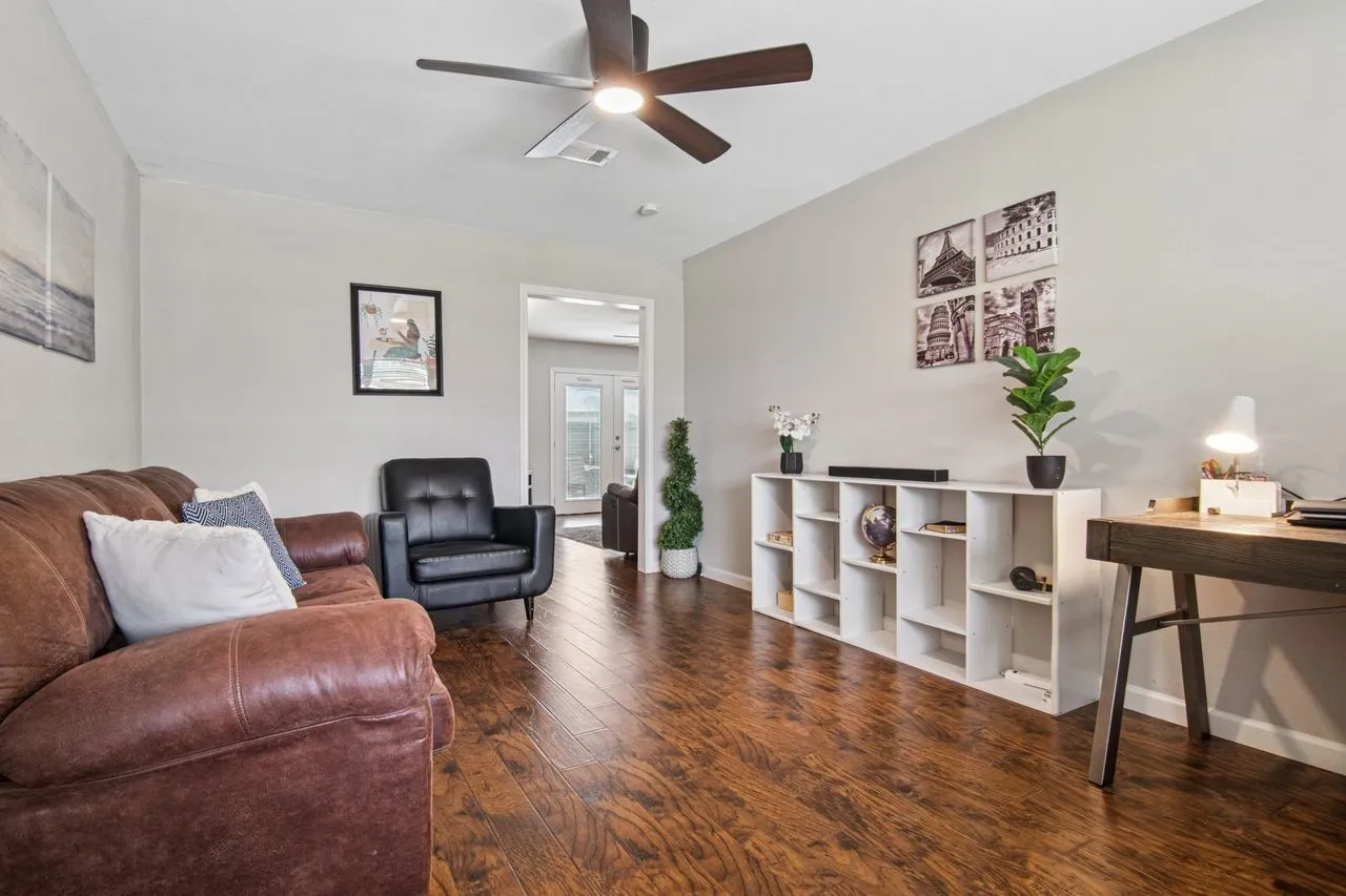 1st Living area. Note handsome wood floors throughout
