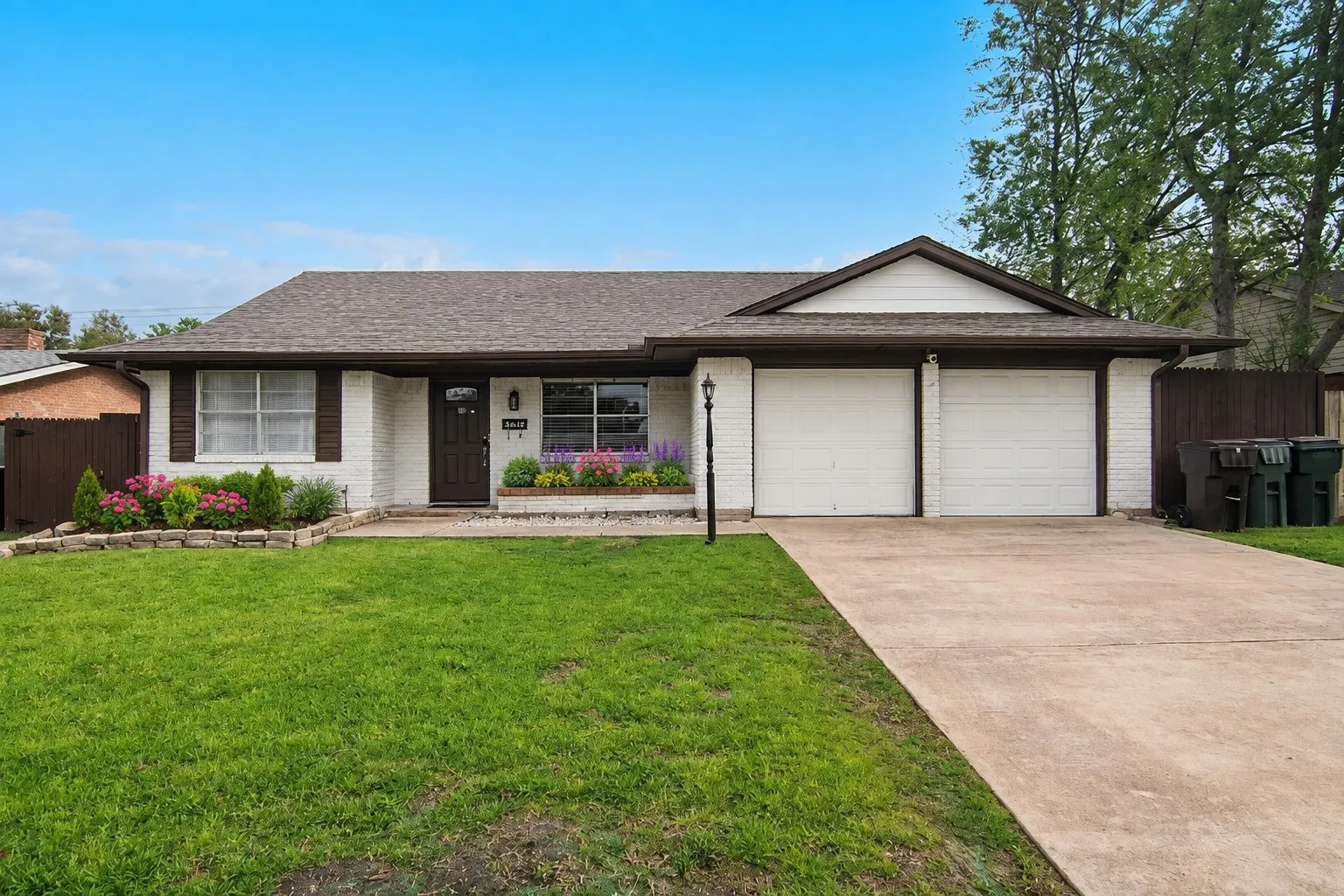 Adorable Brick home with 2 car garage - Staged Flower Beds