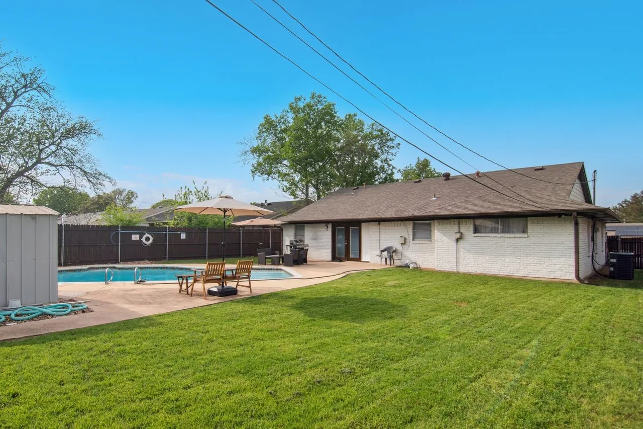 Back view of home with extra yard space