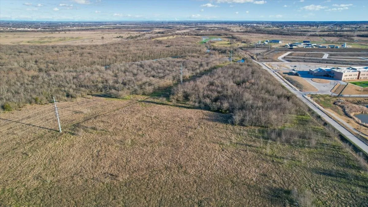 View of land with       elementary school across street.