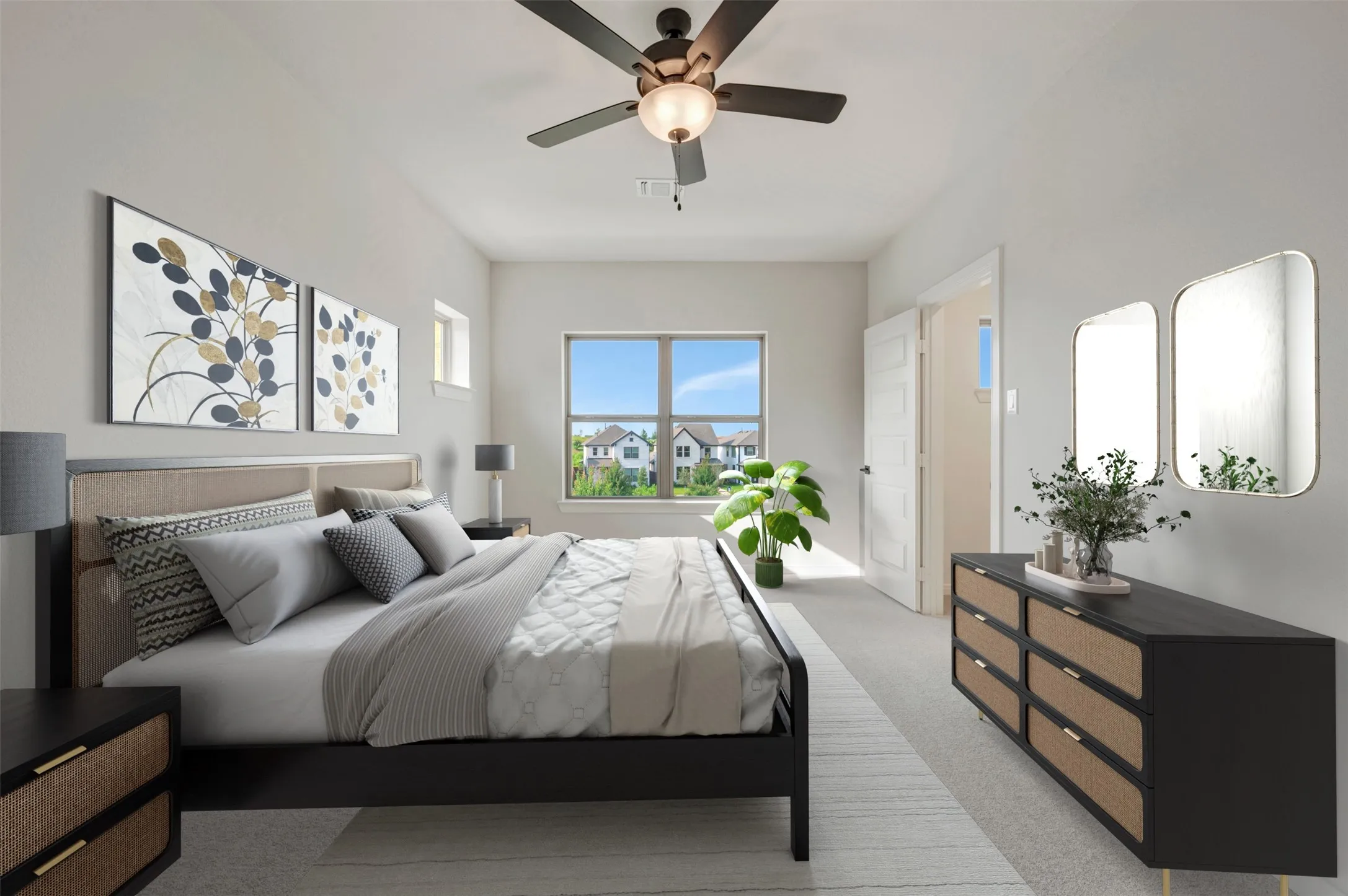 Spacious room featuring vaulted ceilings, a ceiling fan, a large window, and light-colored carpeting