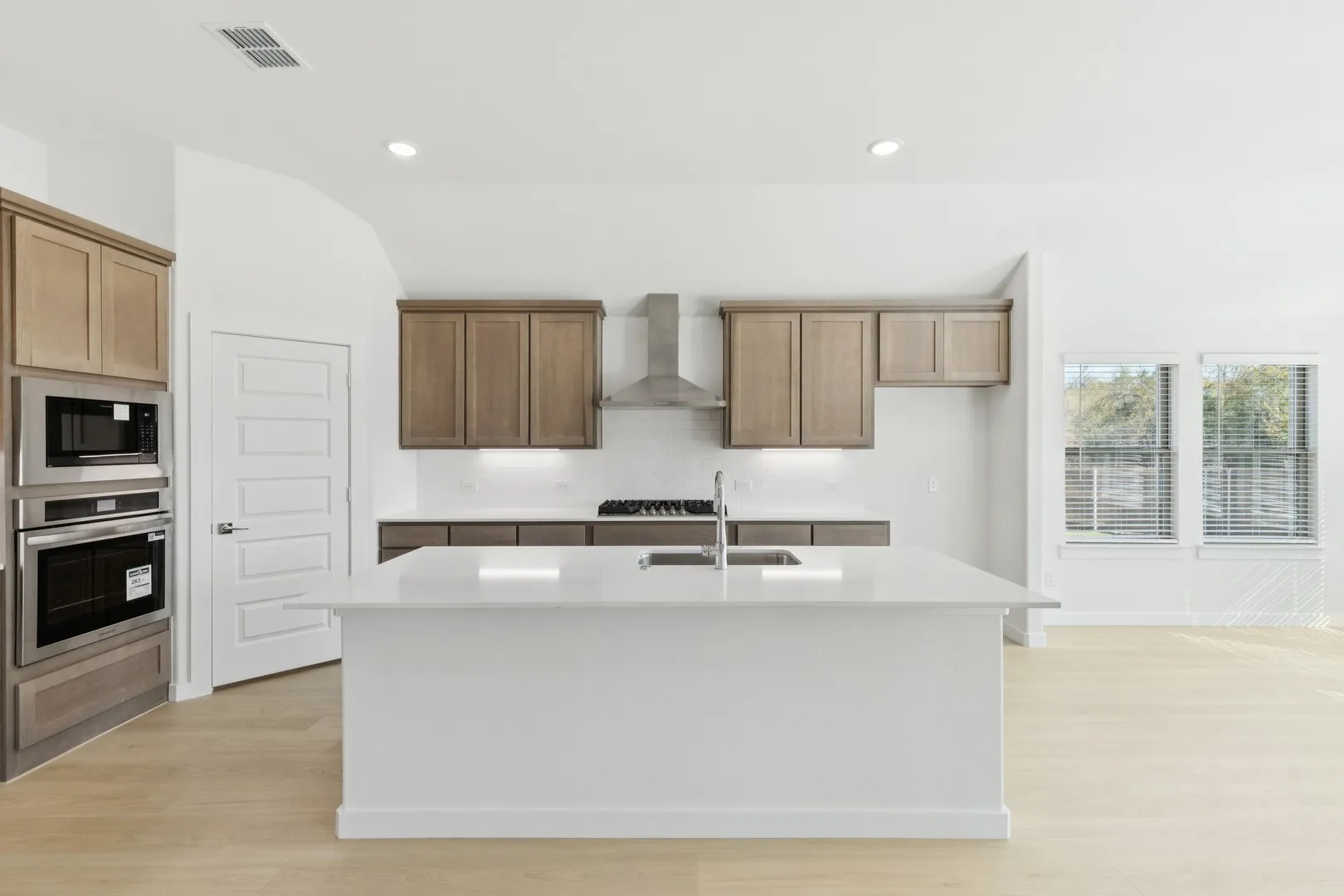Kitchen in the Gilmour II home plan by Trophy Signature Homes – REPRESENTATIVE PHOTO