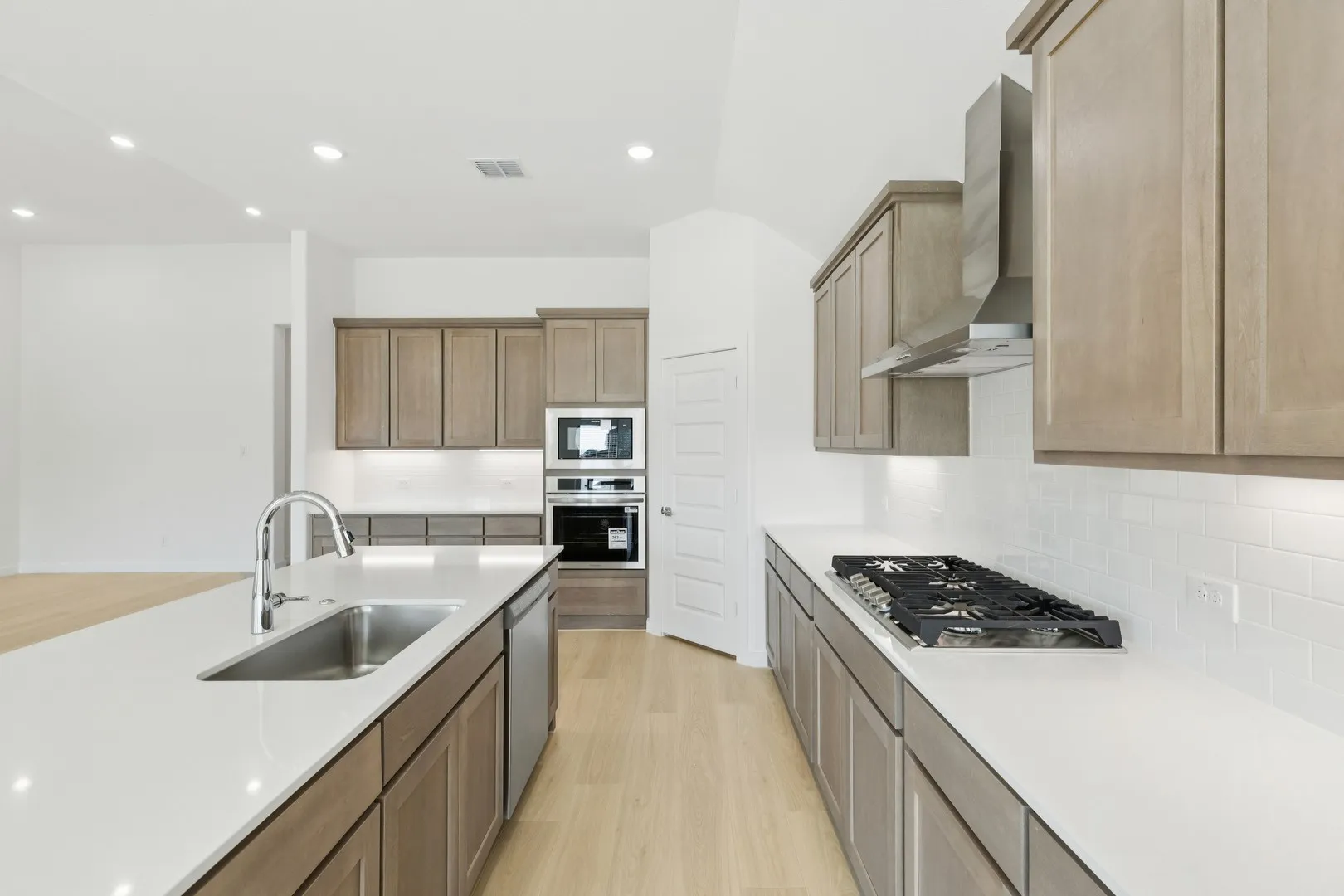 Kitchen in the Gilmour II home plan by Trophy Signature Homes – REPRESENTATIVE PHOTO