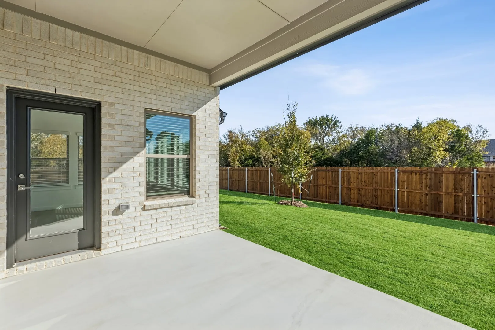 Covered Patio in the Gilmour II home plan by Trophy Signature Homes – REPRESENTATIVE PHOTO