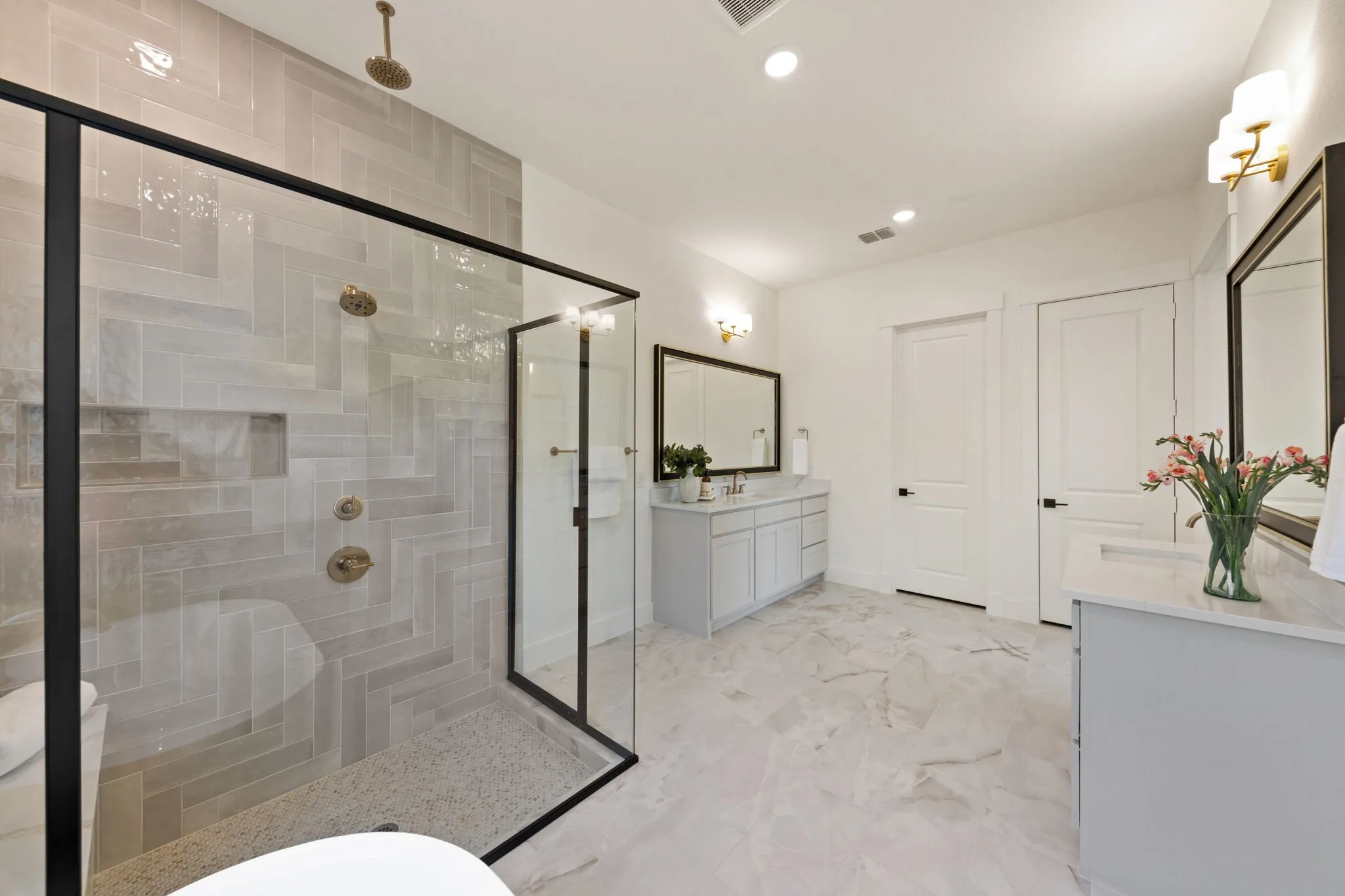 With a wonderful soaking tub and over the top walk in shower, this owner's bath is one for the ages!