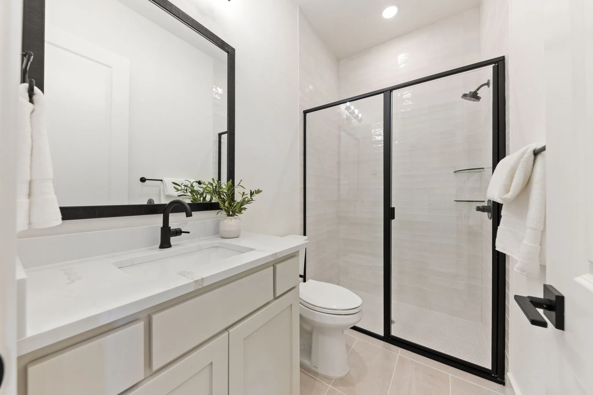 Friends and family will feel right at home in any of the beautifully finished guest baths.
