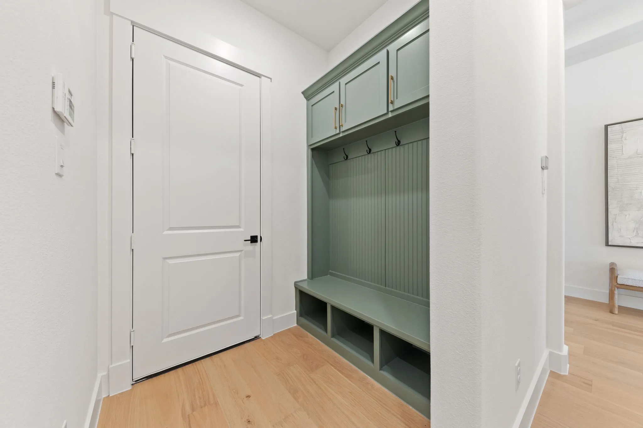 This custom built-in mud bench with storage creates the perfect drop zone for the kiddos back packs and sporting equipment.