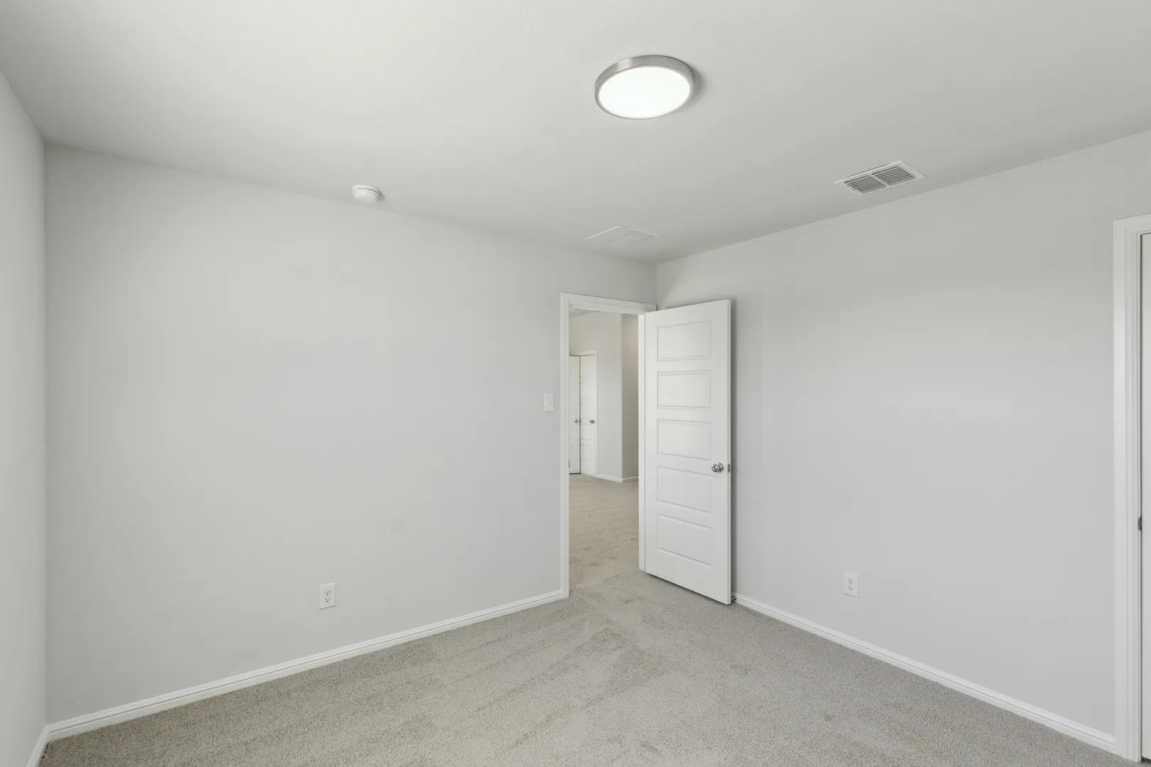 Bedroom in the Holden home plan by Trophy Signature Homes – REPRESENTATIVE PHOTO