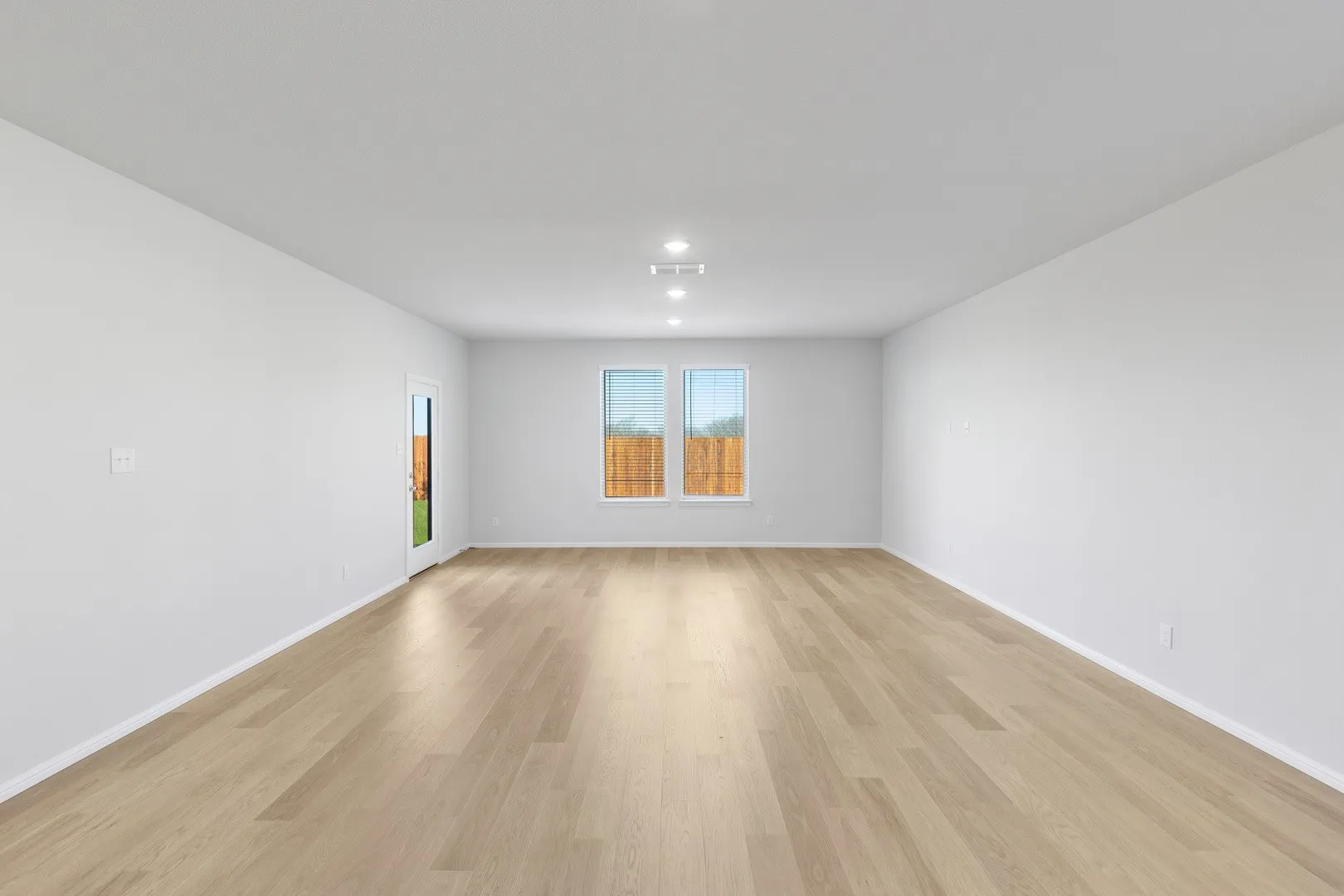 Living and Dining Room in the Holden home plan by Trophy Signature Homes – REPRESENTATIVE PHOTO