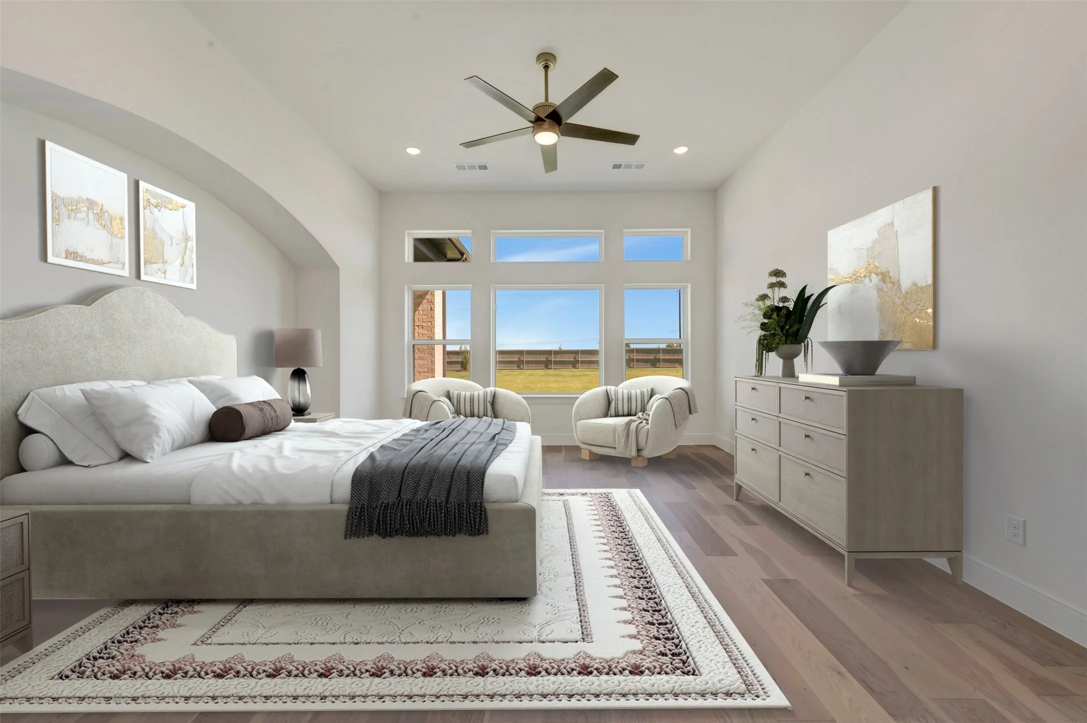 Vaulted ceiling room featuring expansive window banks, wood-finish flooring, a contemporary ceiling fan, and recessed lighting