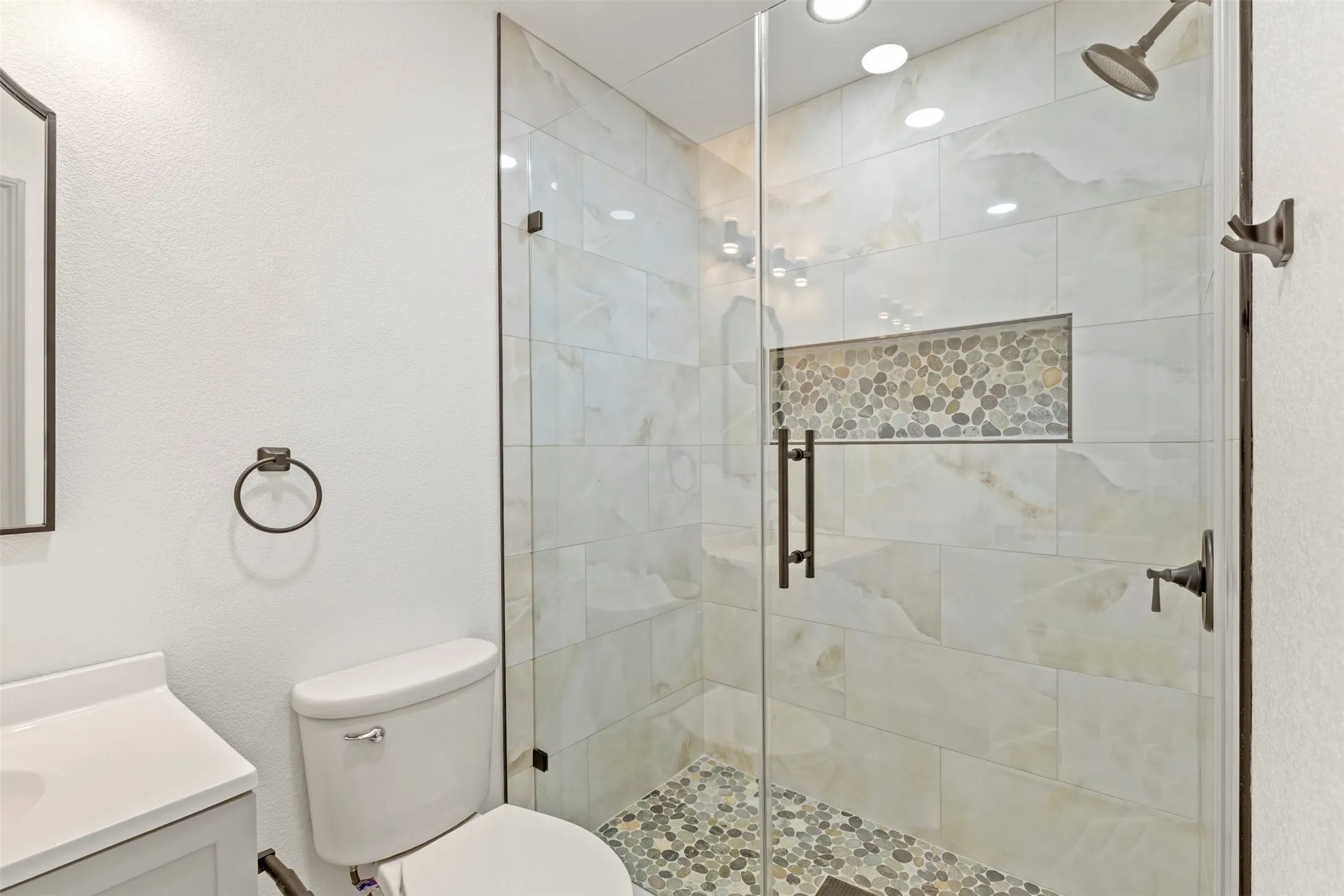 Bathroom with vanity and a shower stall