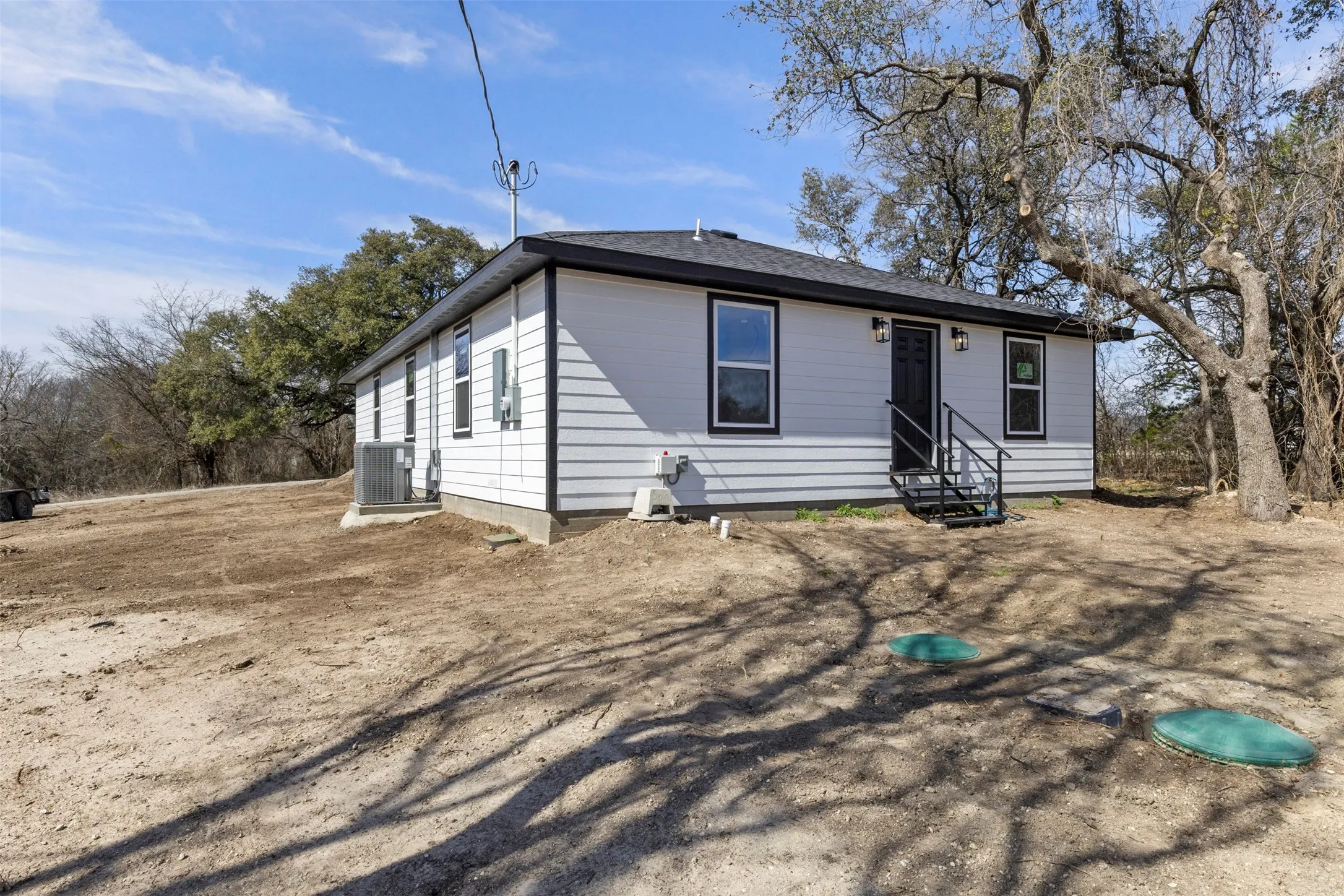 Rear view of property with entry steps