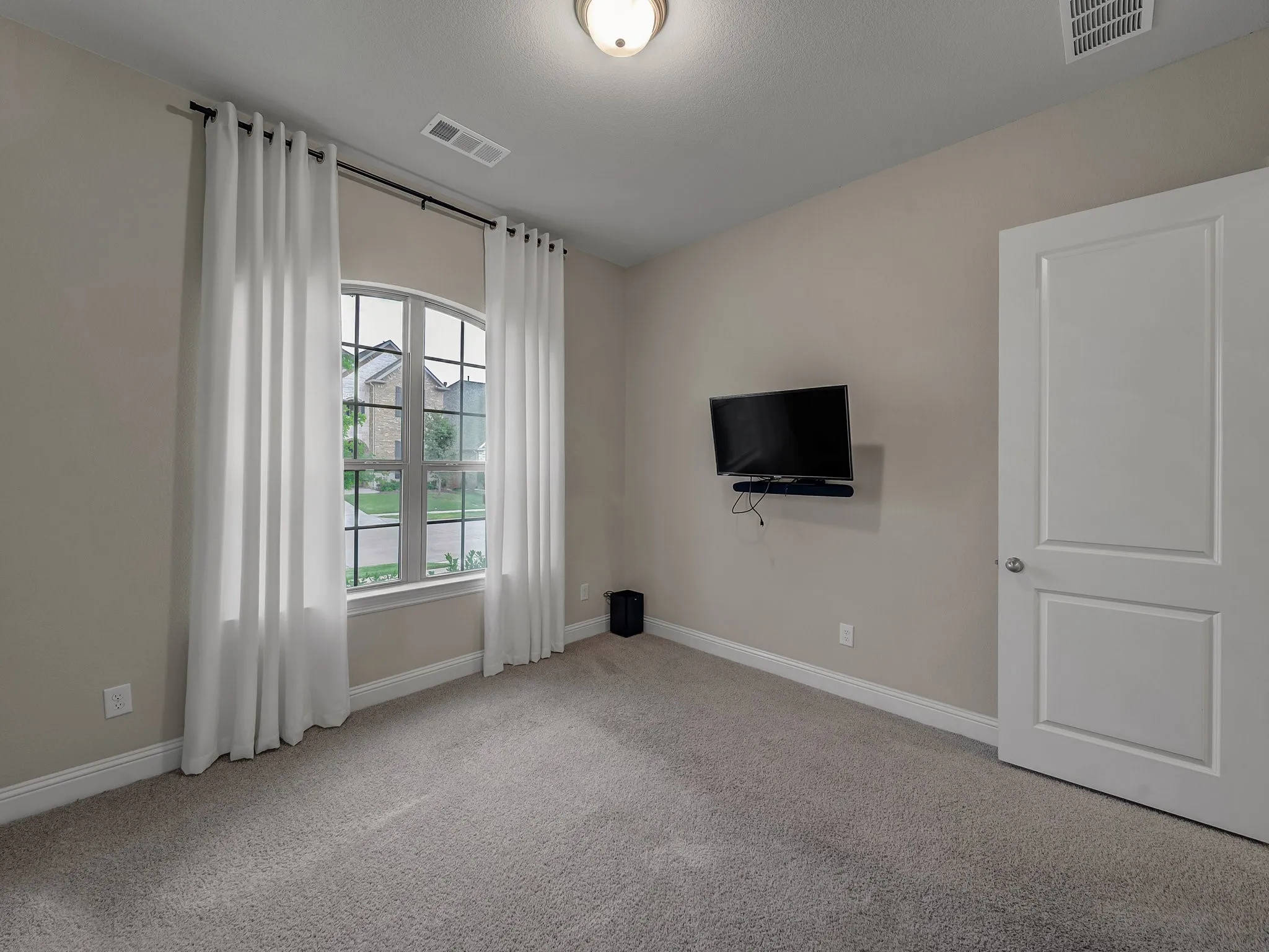 Unfurnished room with carpet flooring and baseboards