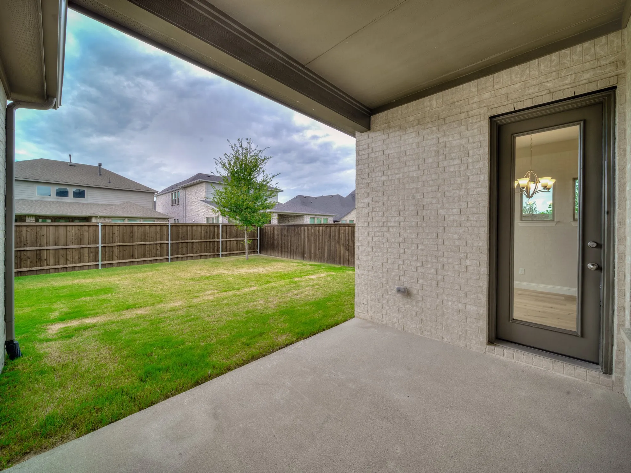 Fenced backyard featuring a patio area