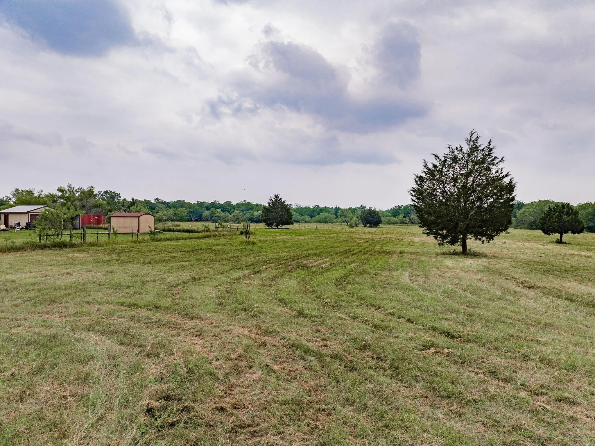 View of grassy yard with a rural view