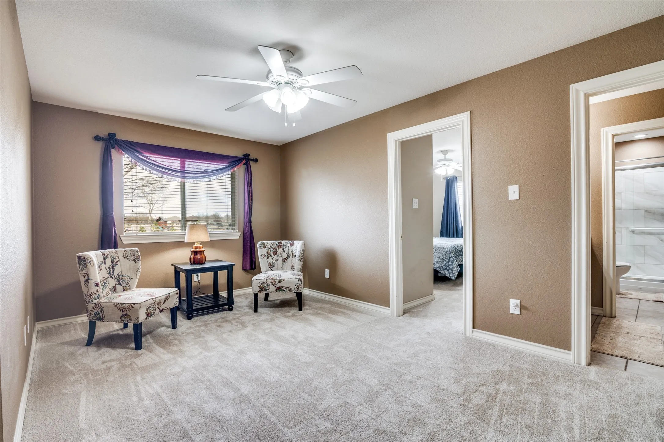 Game/Sitting room featuring ceiling fan and carpet
