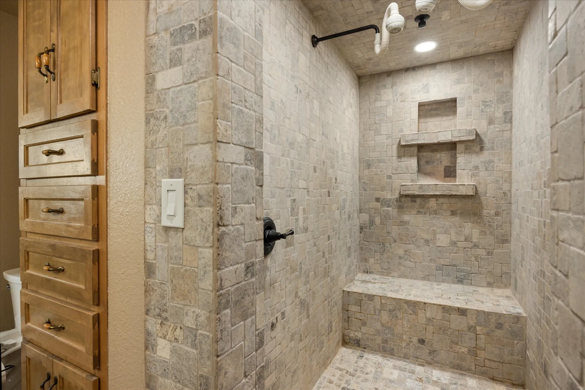 Bathroom featuring tiled shower