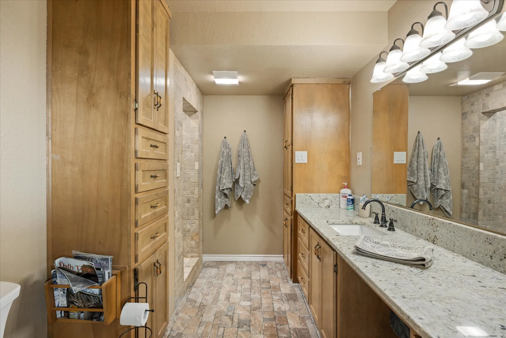 Bathroom with vanity and walk in shower