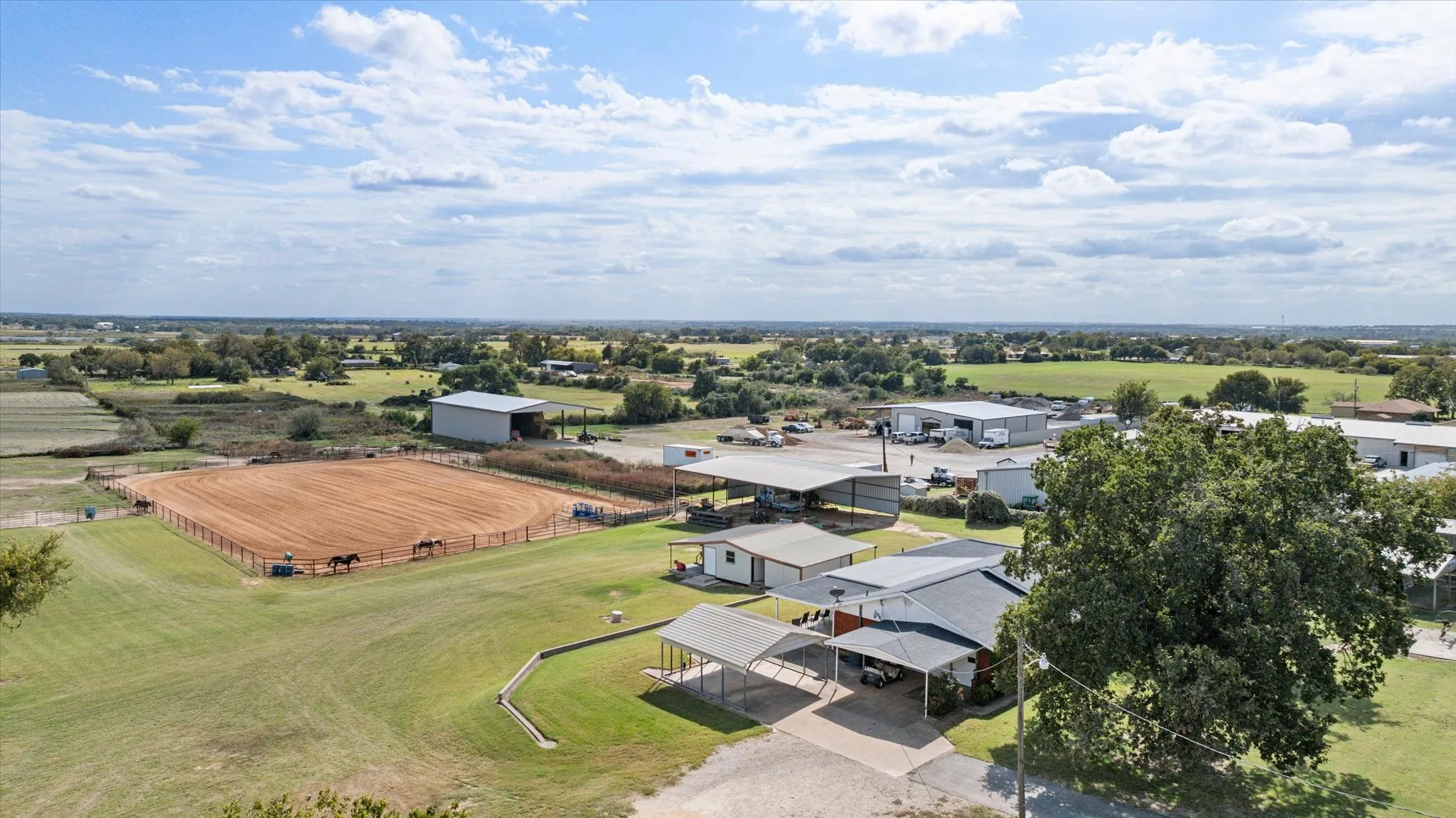 Birds eye view of property featuring a rural view