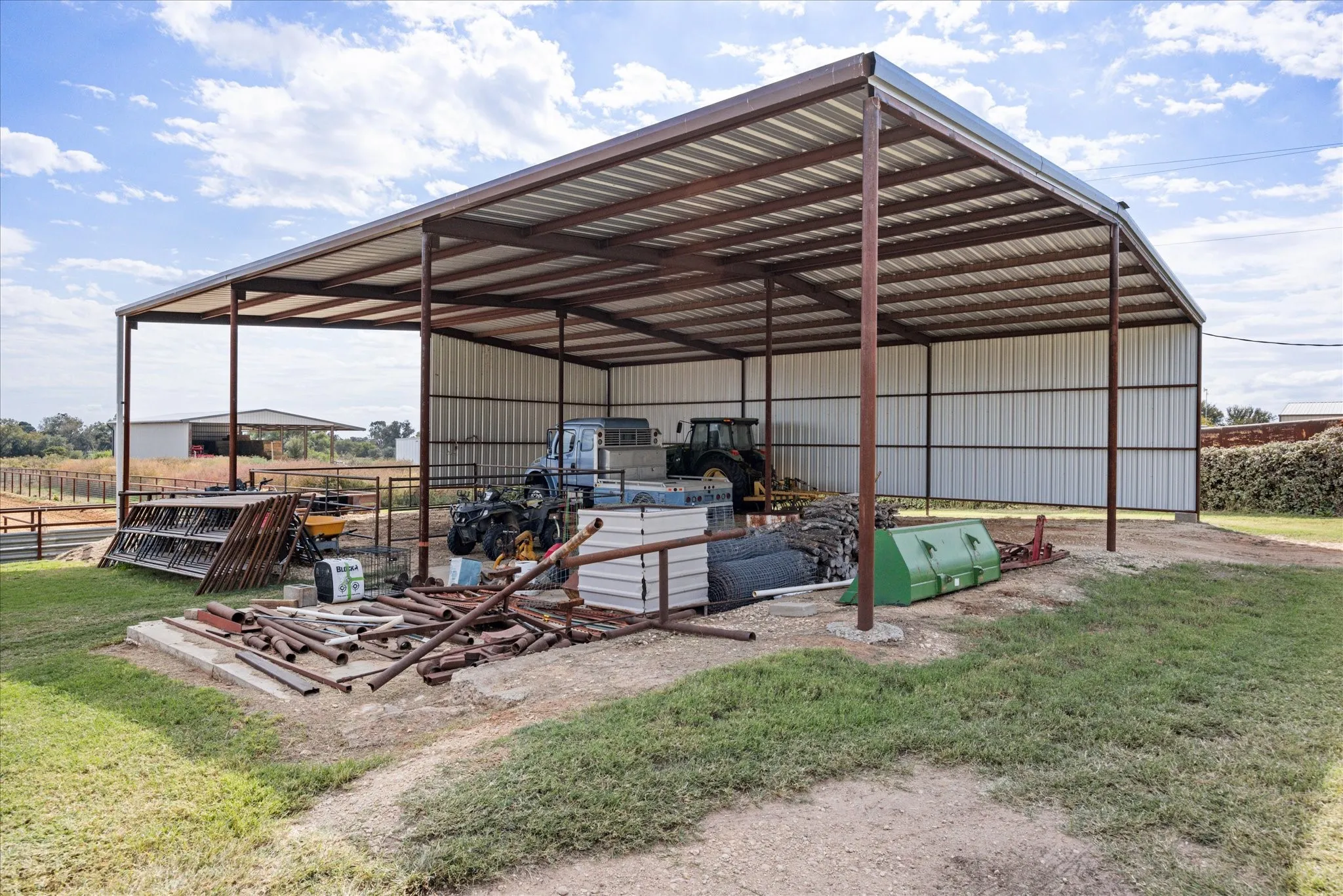 View of outbuilding with a lawn