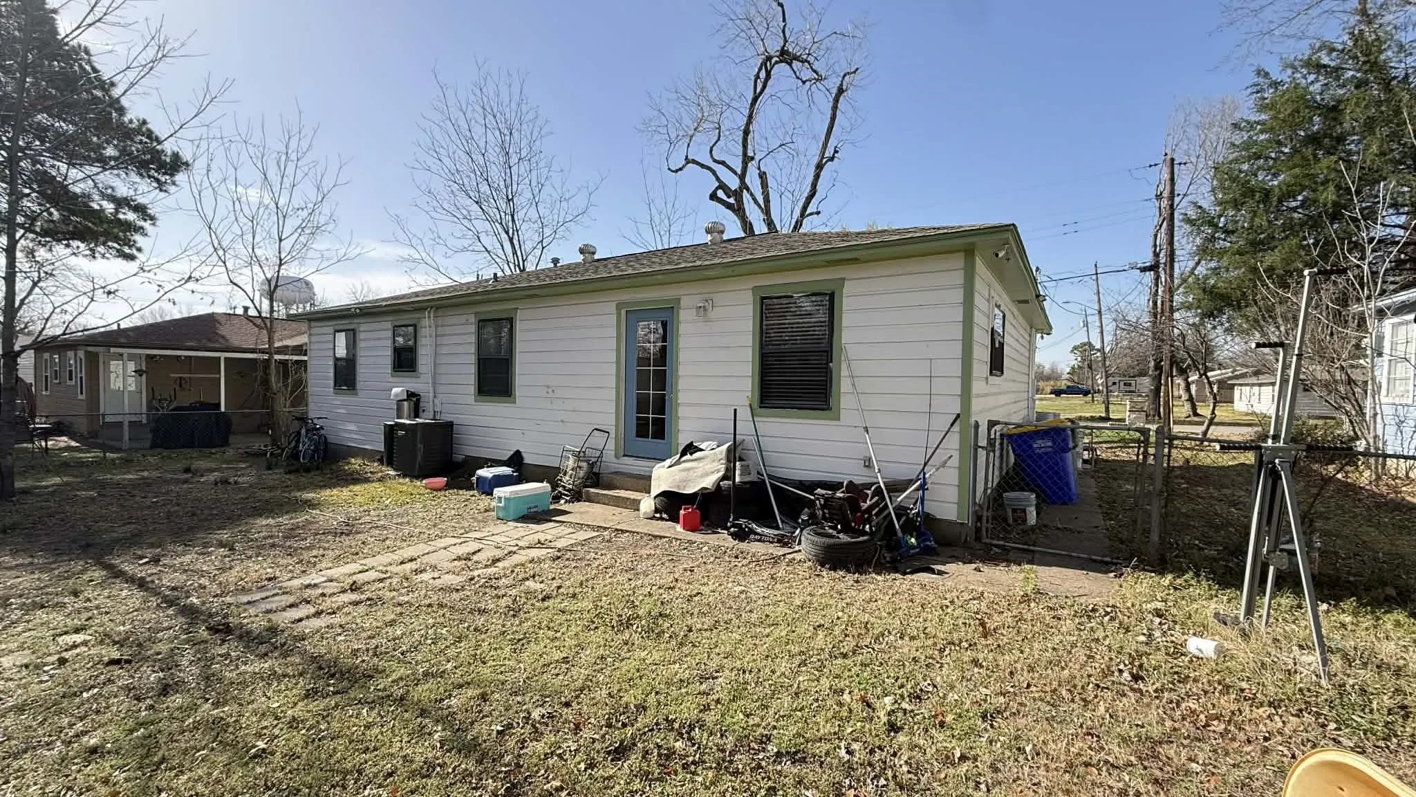 Rear view of property featuring entry steps and a patio