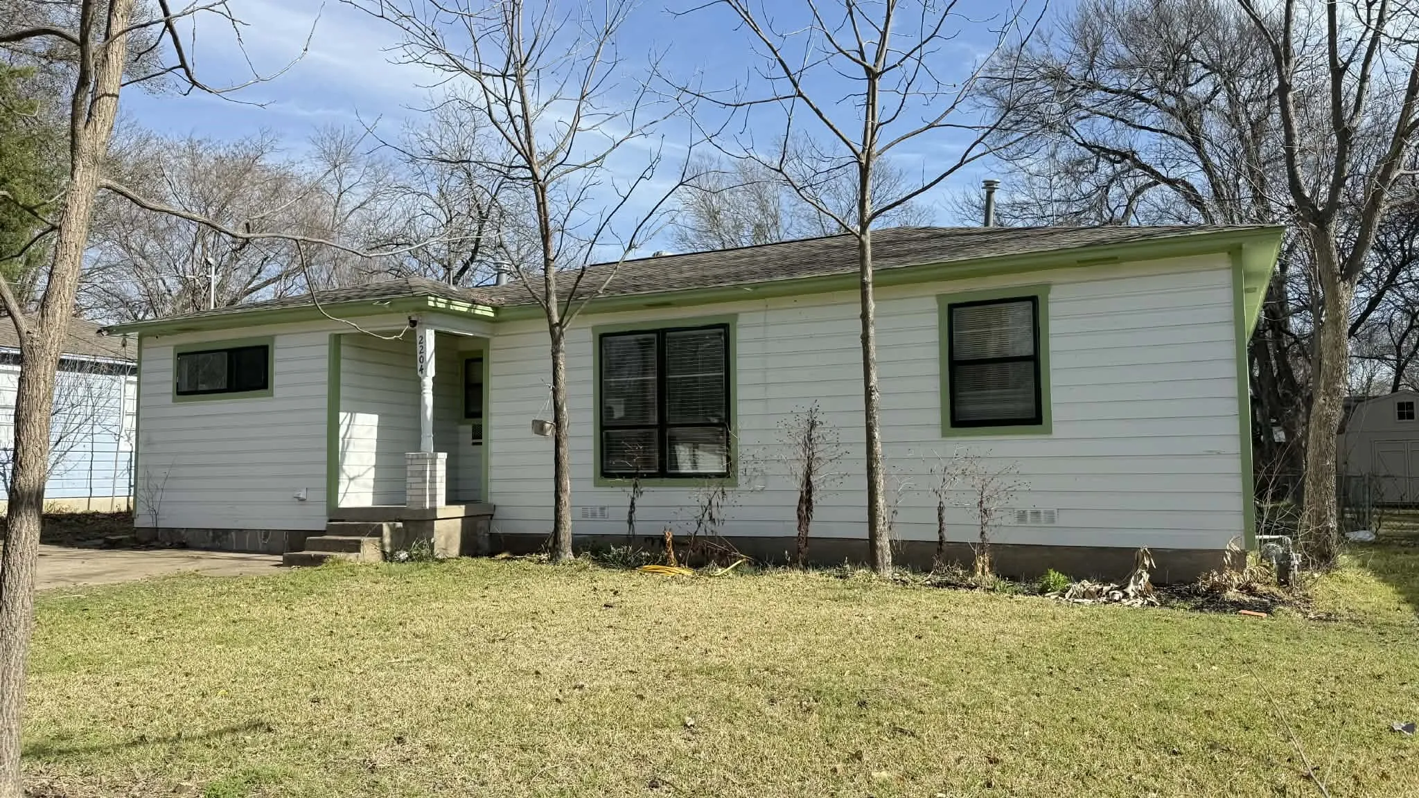 Ranch-style home with a front lawn