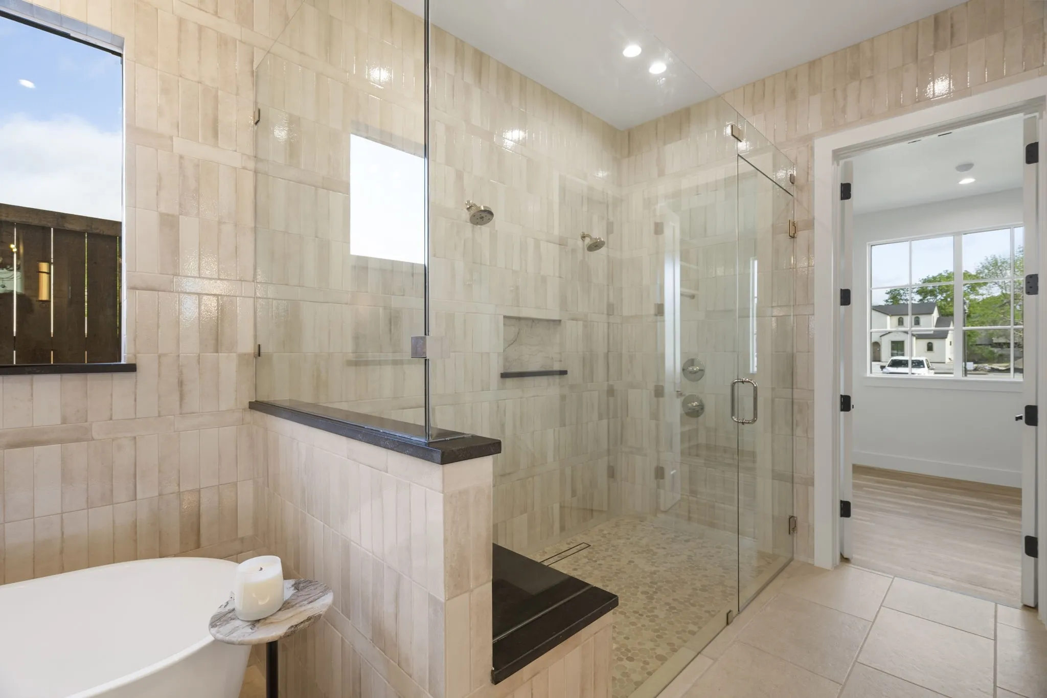 Full bathroom featuring a freestanding bath, a stall shower, light tile patterned floors, and recessed lighting