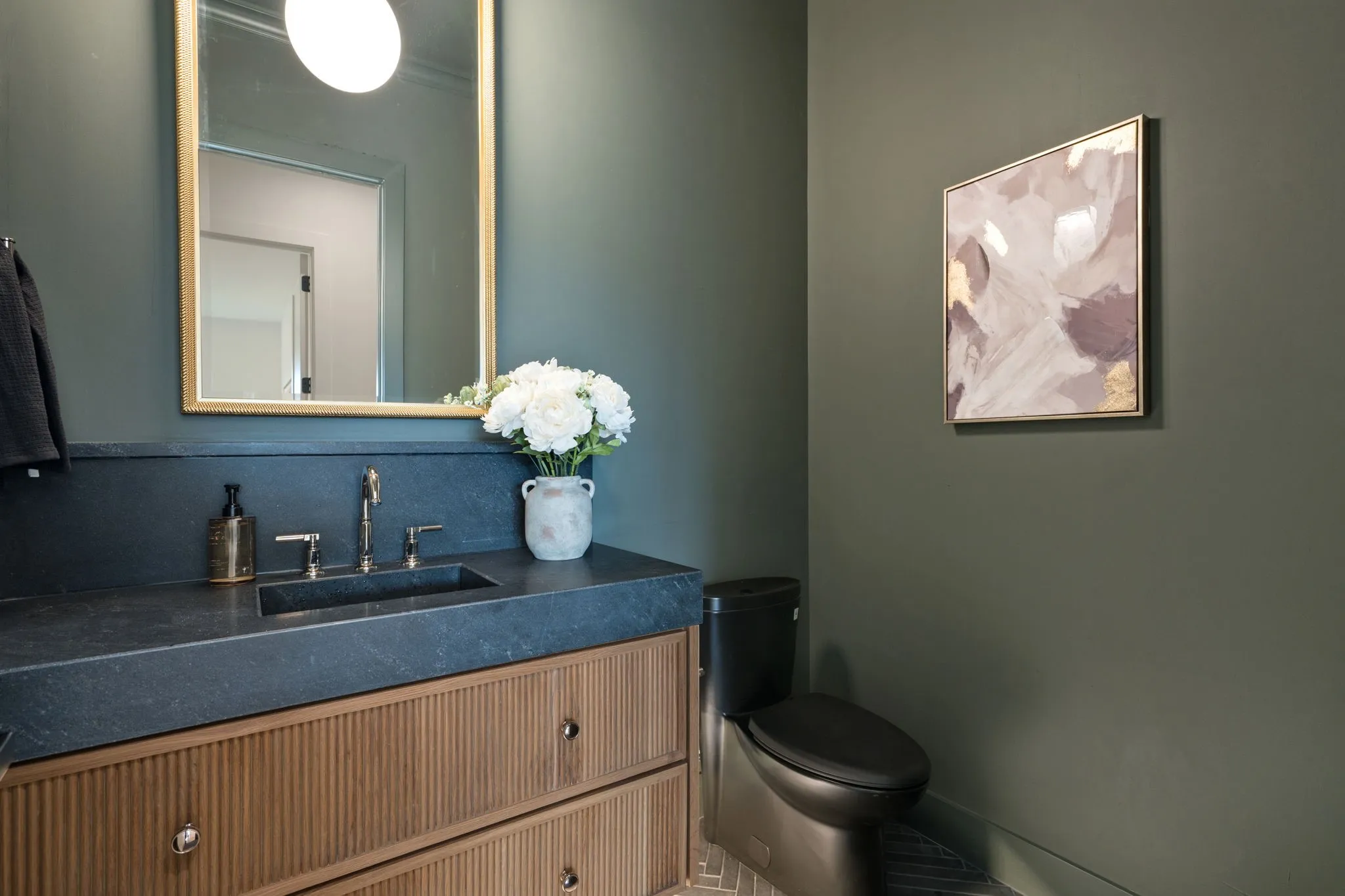Half bath featuring vanity and toilet
