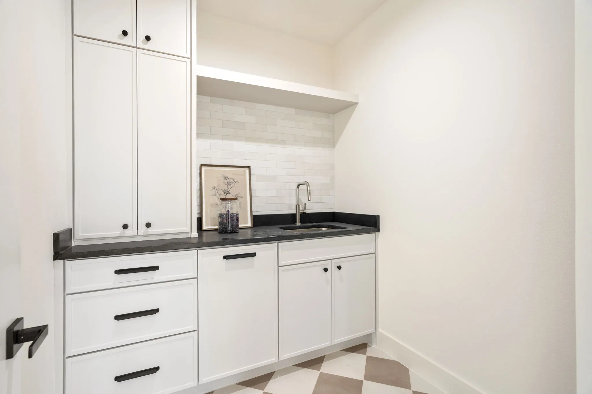 2nd Laundry Upstairs featuring light flooring, white cabinets, tasteful backsplash, open shelves, and dark stone counters