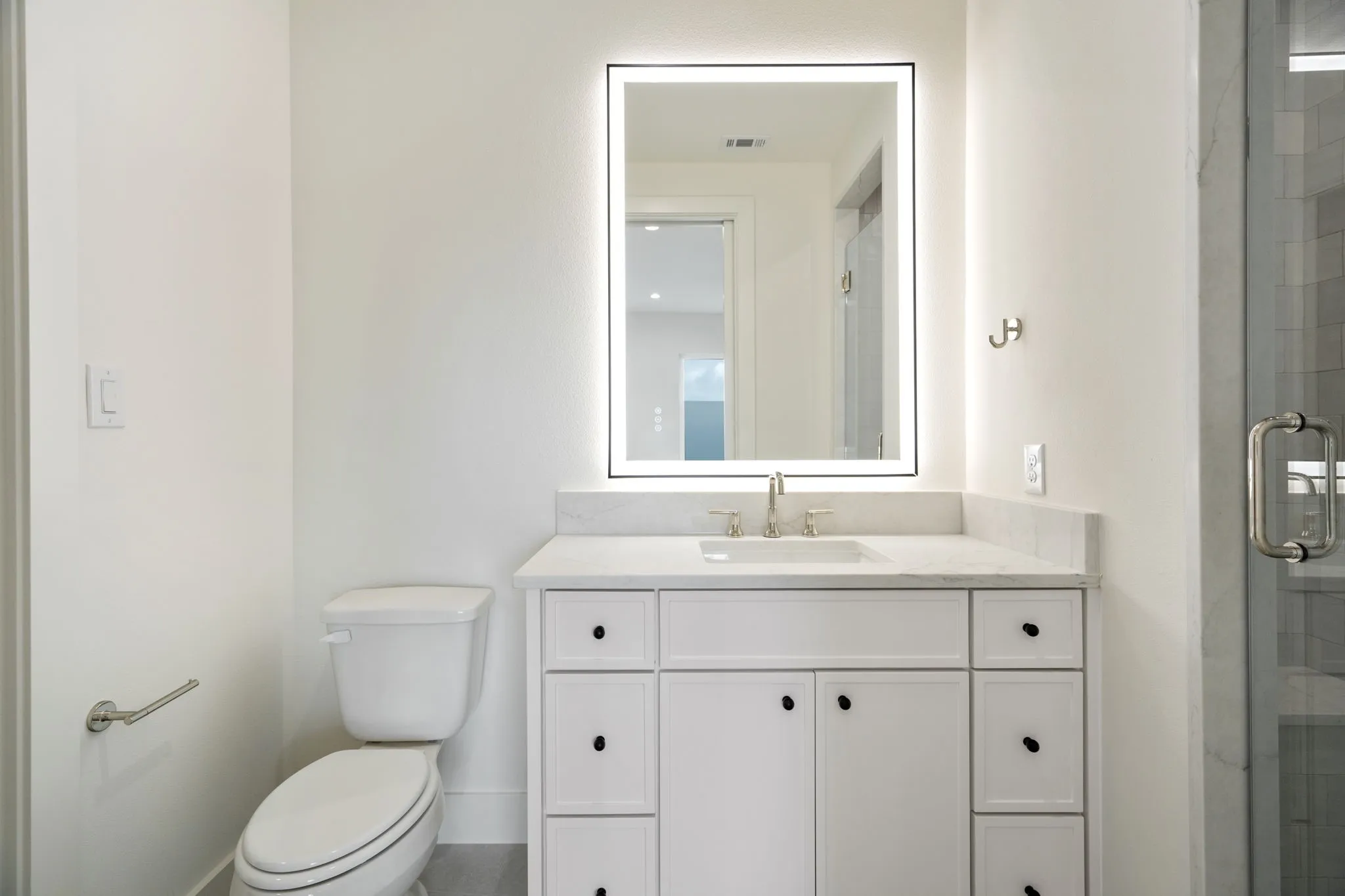 Full bath with vanity and a stall shower