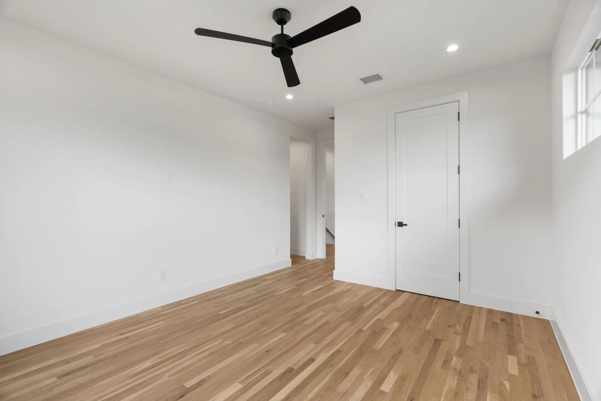 Unfurnished bedroom with light wood-style flooring, recessed lighting, and a ceiling​​‌​​​​‌​​‌‌​‌‌​​​‌‌​‌​‌​‌​​​‌​​ fan