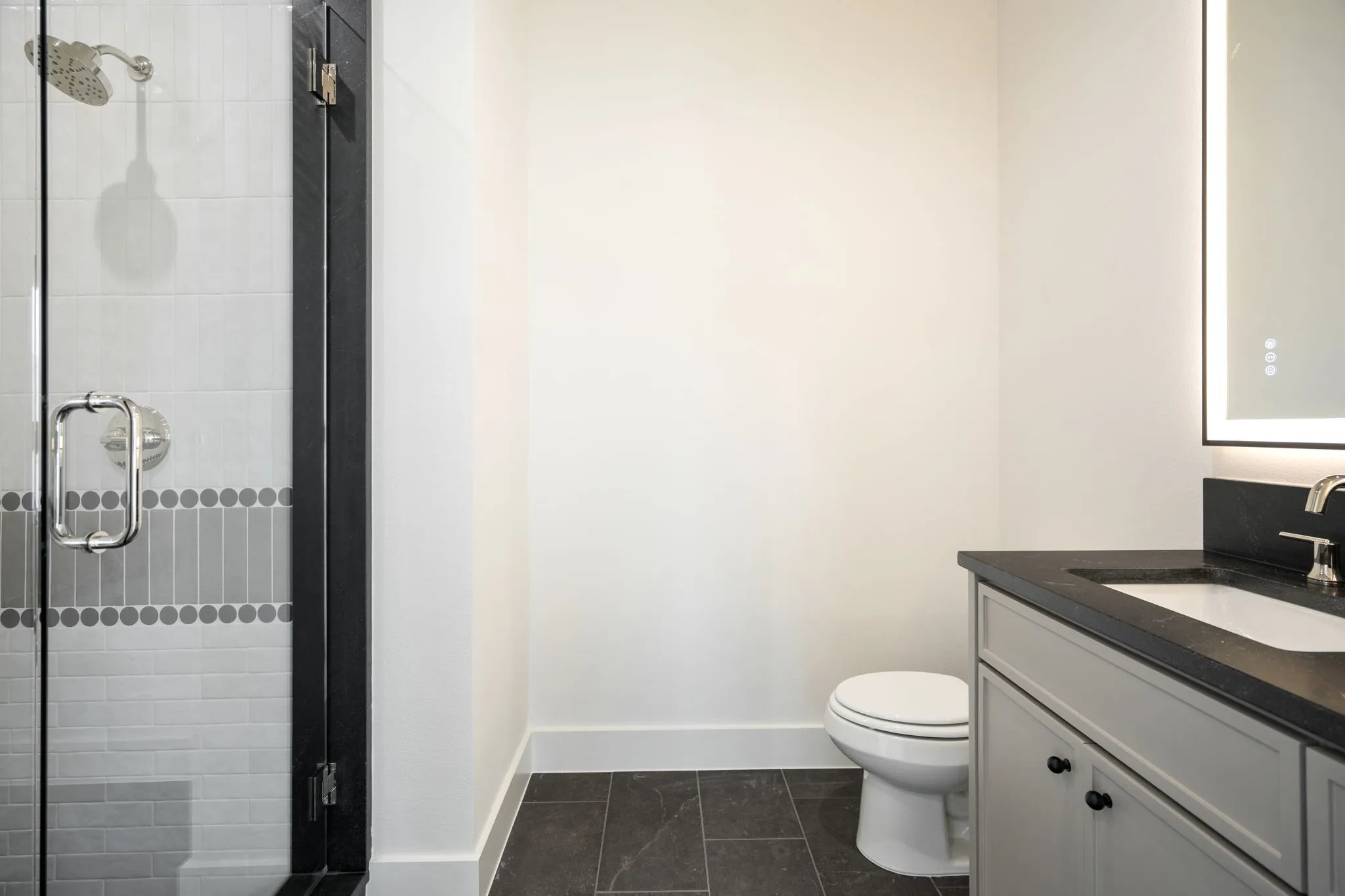 Full bath with vanity and a stall shower