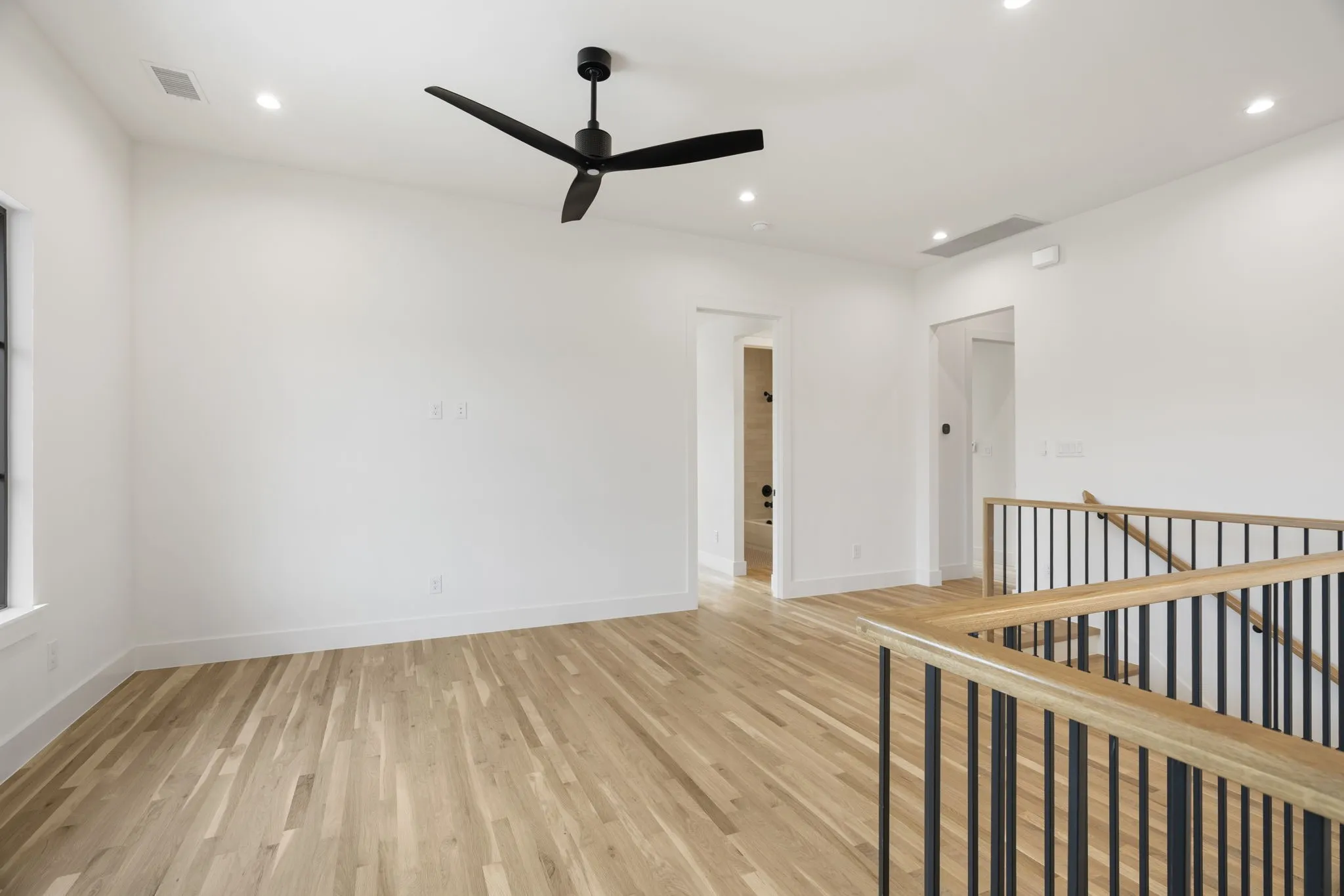 Upstairs Loft featuring light wood-style floors, recessed lighting, and ceiling fan