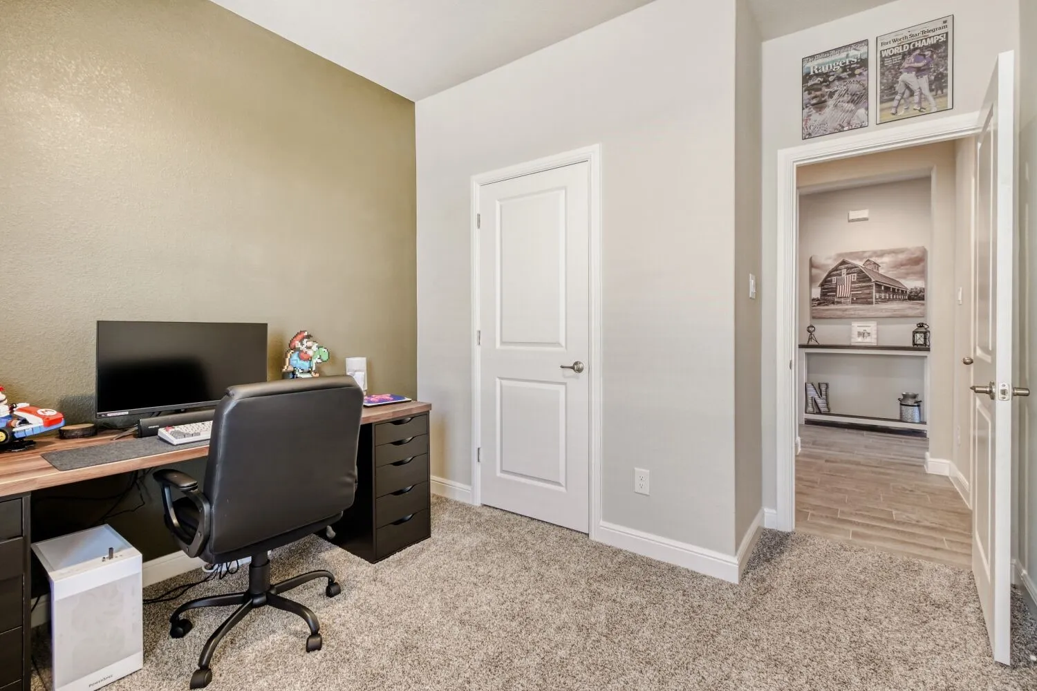 Office featuring light colored carpet and baseboards