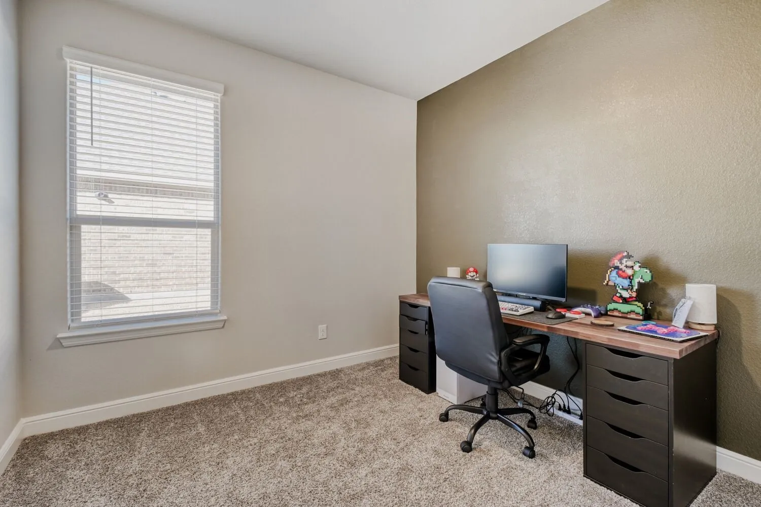 Office area with light carpet and baseboards