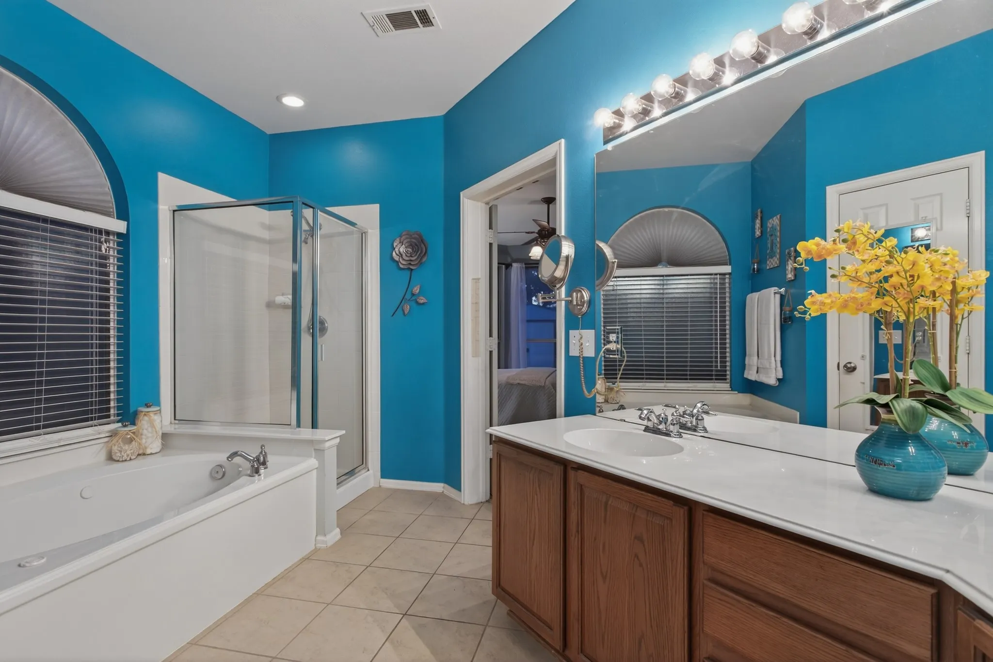 Primary bath offers a relaxing retreat with jetted tub, separate shower, double vanities & spacious walk-in closet.