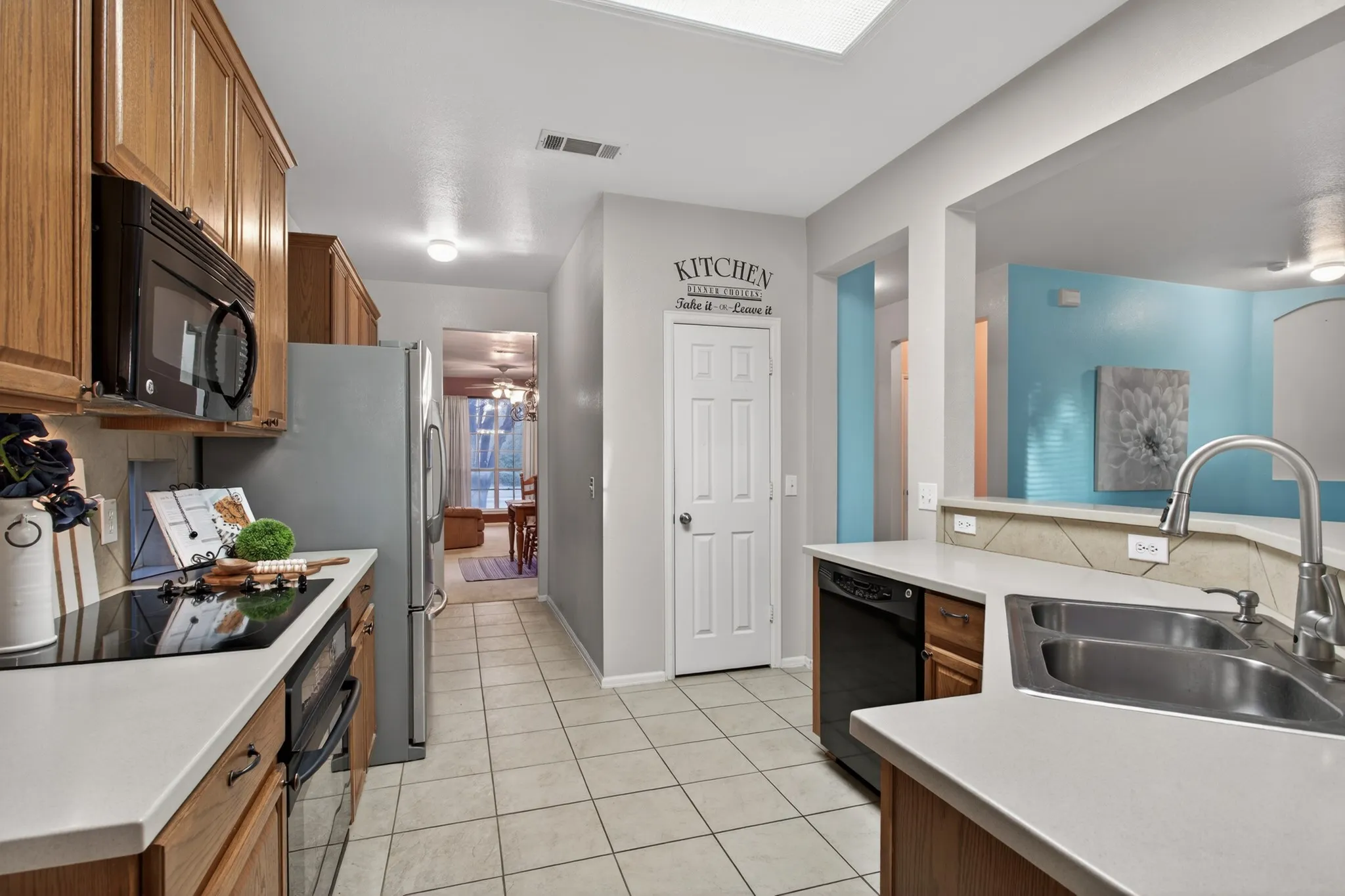 Kitchen features extensive built-in cabinetry, abundant counter space, pantry & butler’s pantry for coffee bar or food prep.