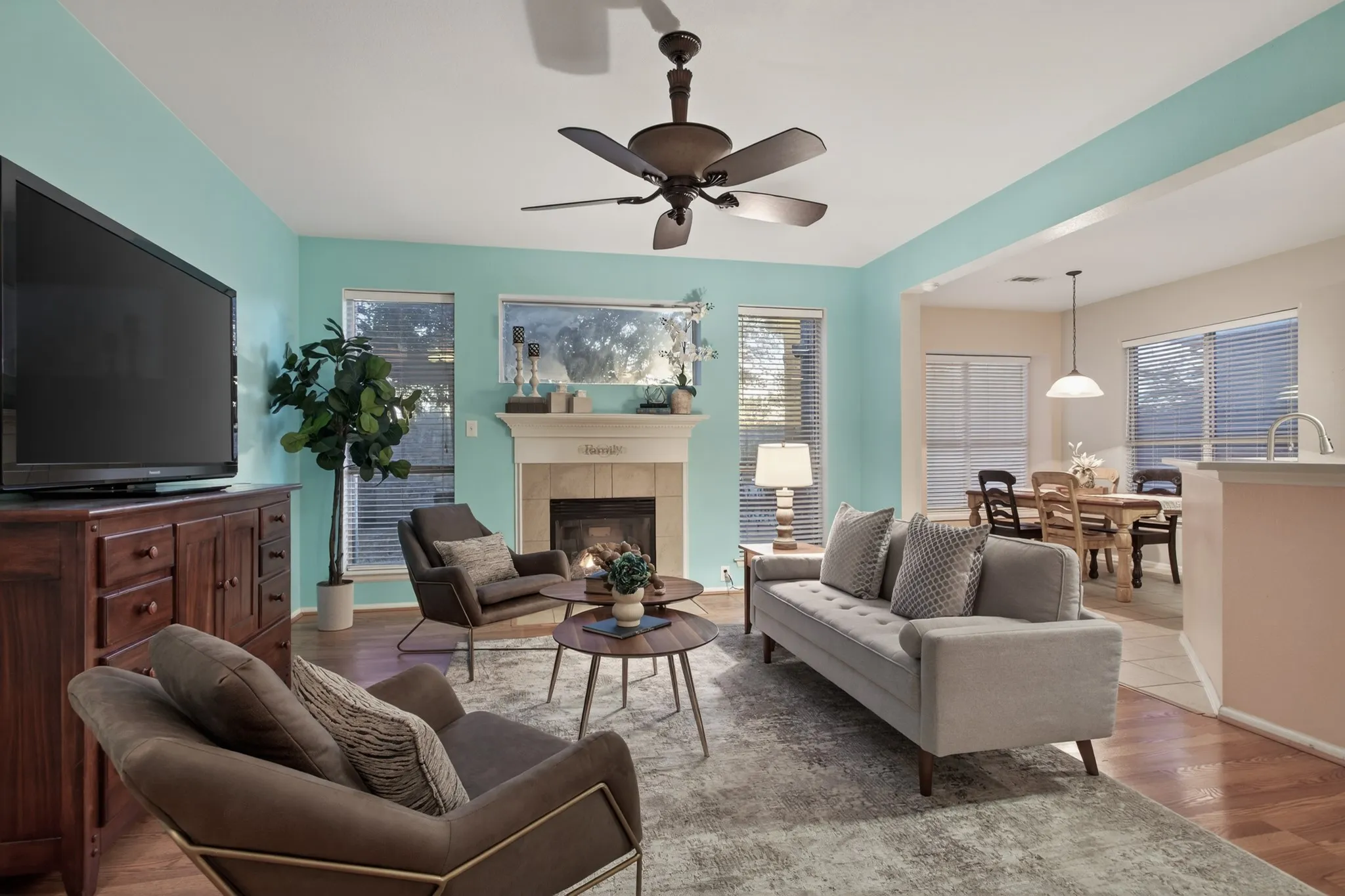 The heart of the home is a spacious main living with charming fireplace that connects effortlessly to the kitchen & breakfast area.
