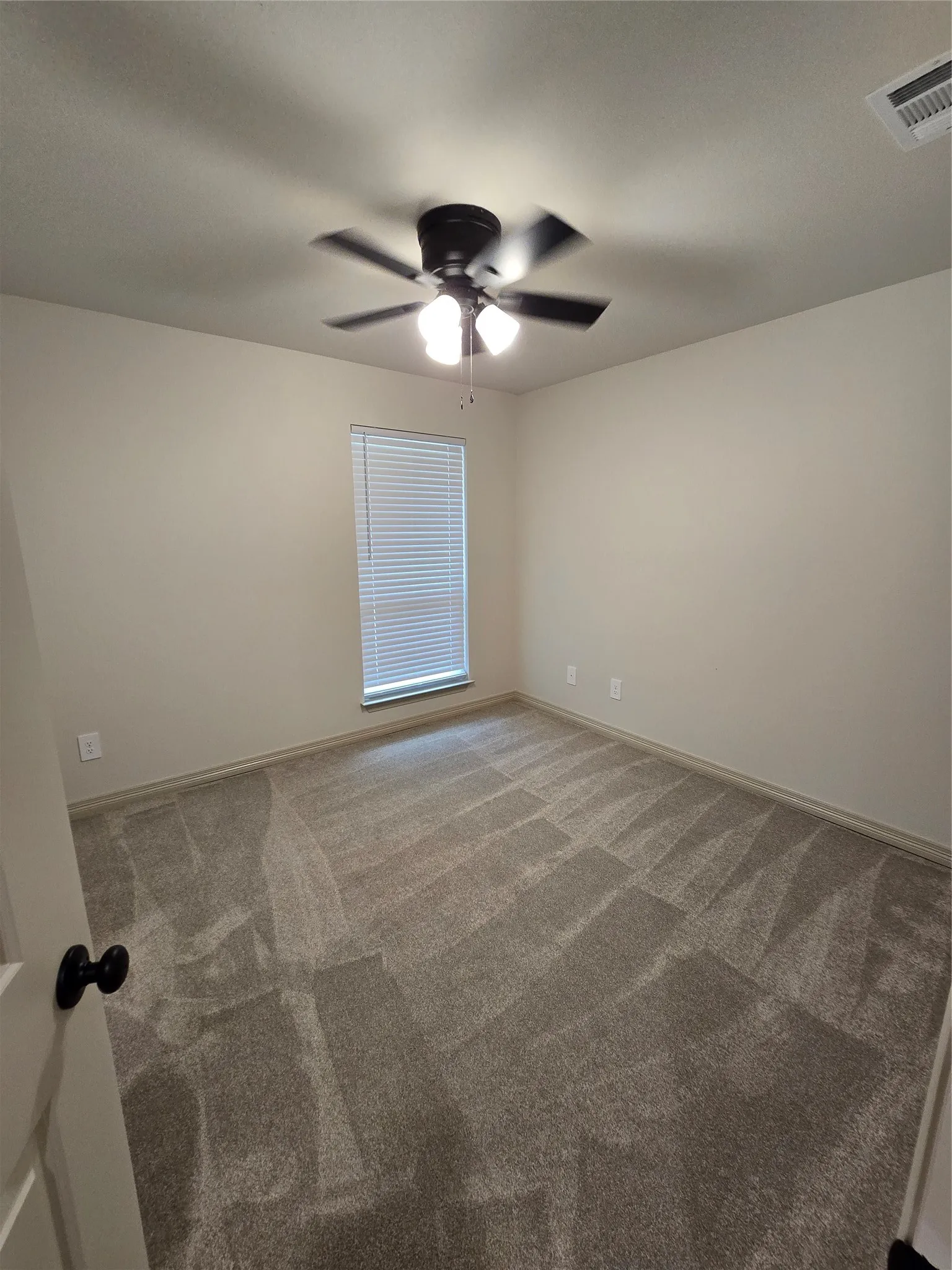 Bedroom with closet, carpet floors and ceiling fan