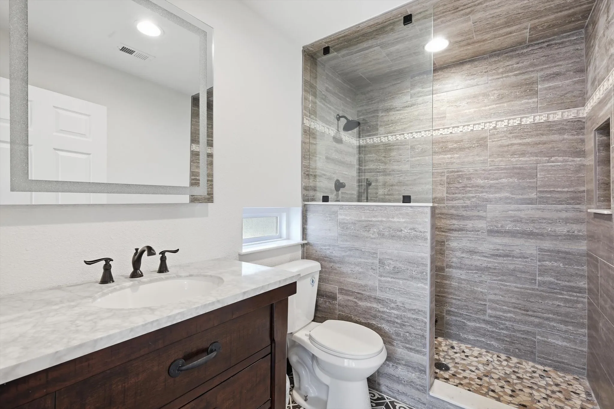 Full bath with vanity and a walk in shower