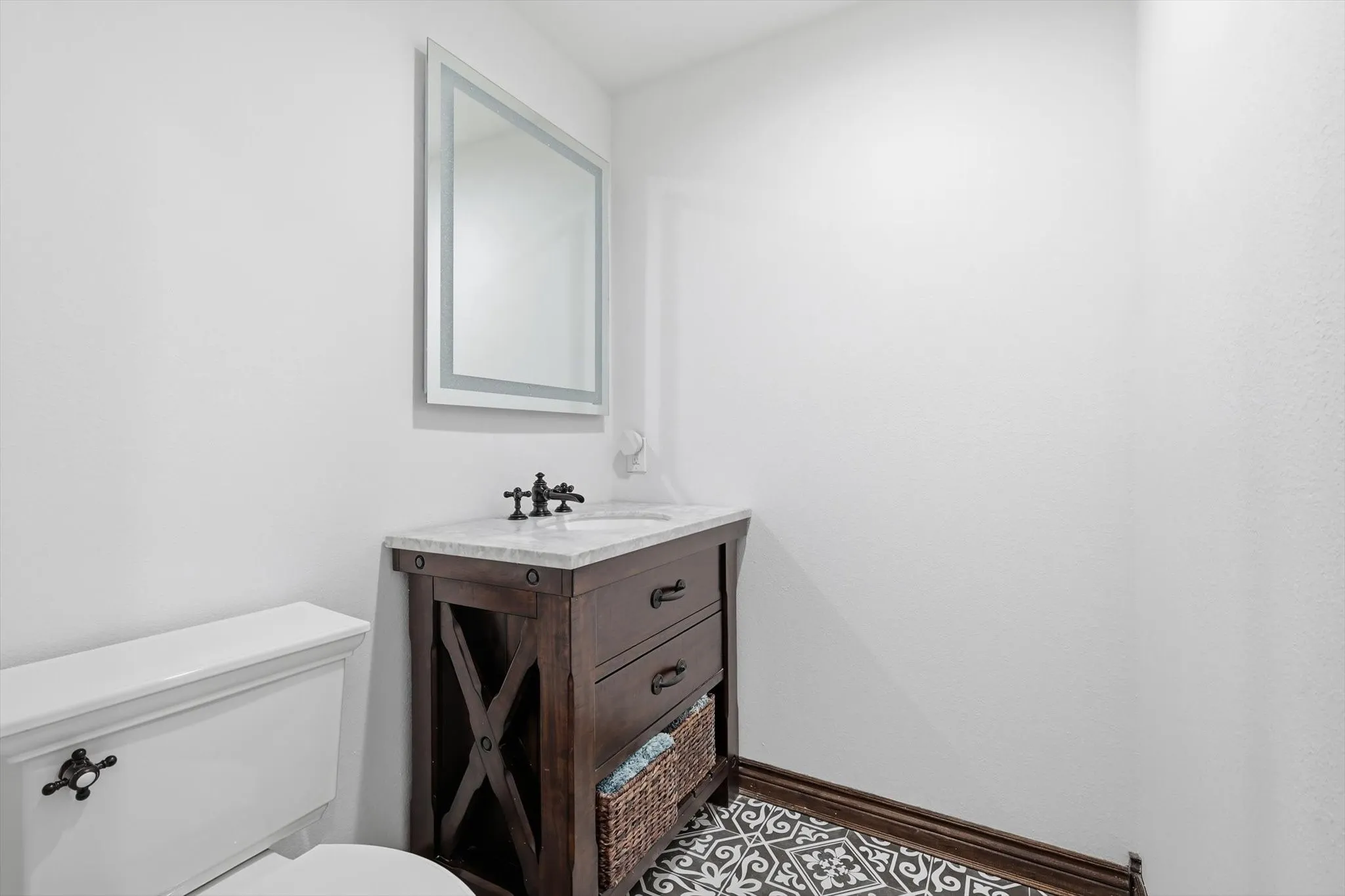 Half bath with vanity and toilet