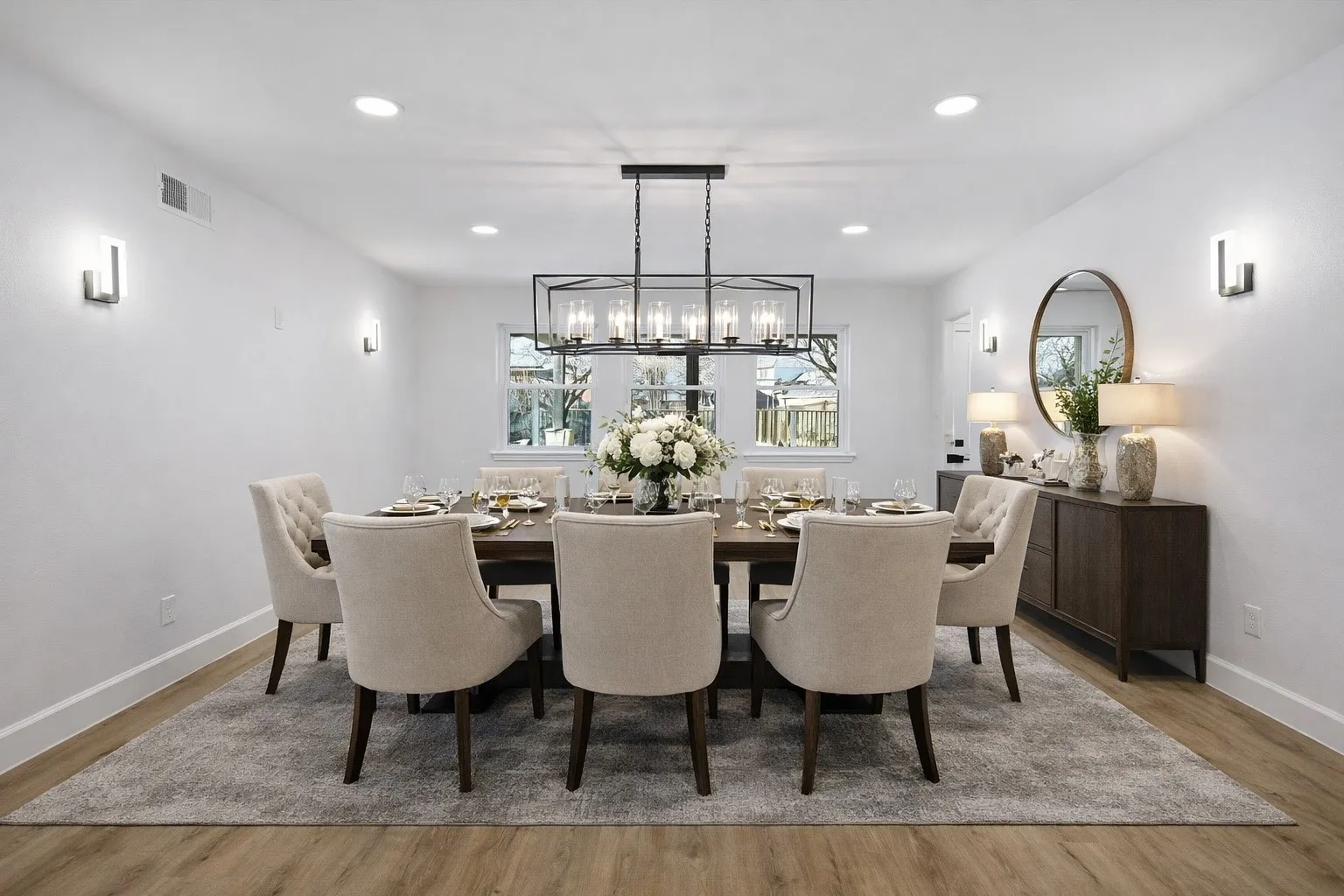 VIRTUALLY STAGED Dining area with light wood-style flooring and recessed lighting