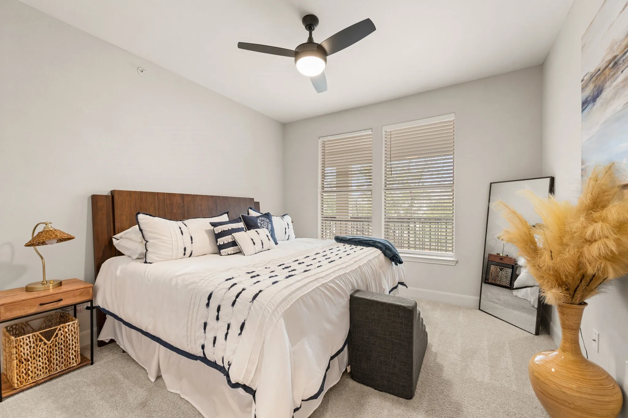 Bedroom featuring ceiling fan and light carpet