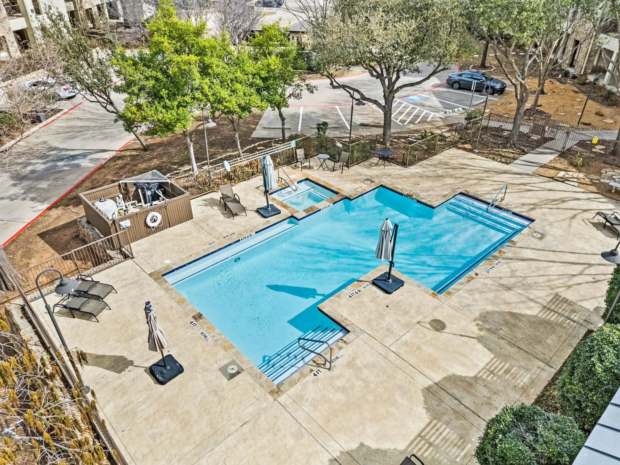 Community pool with a patio area