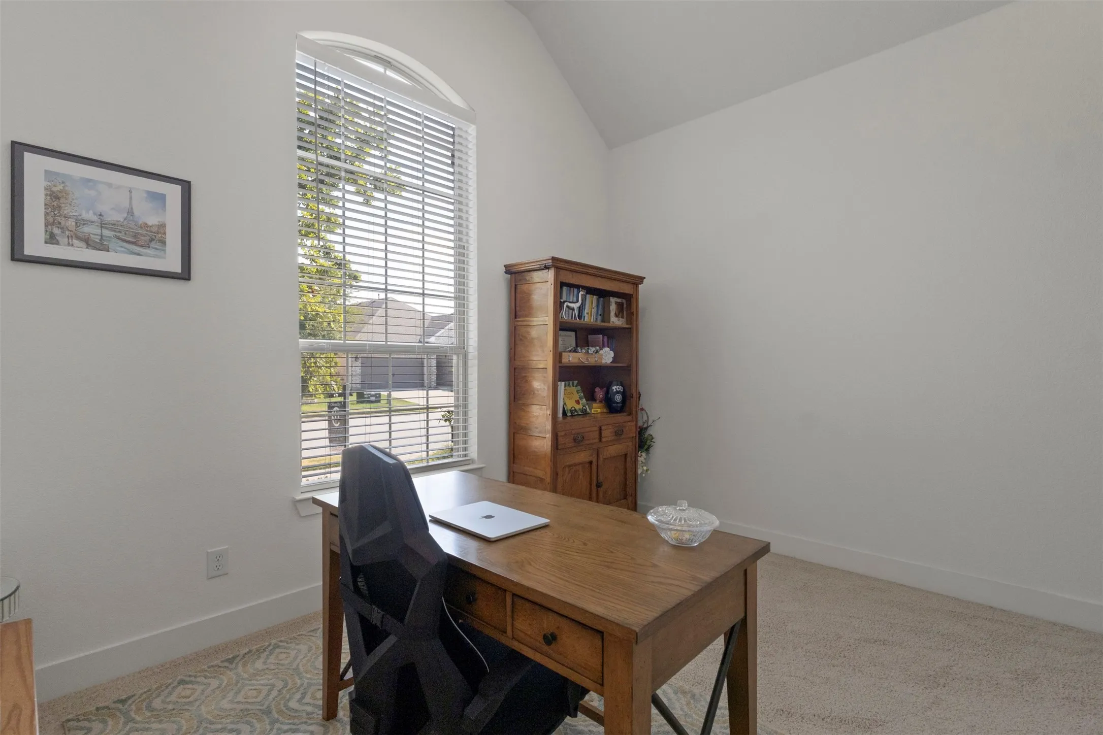 4th bedroom currently used as an office with views of the front of the home.